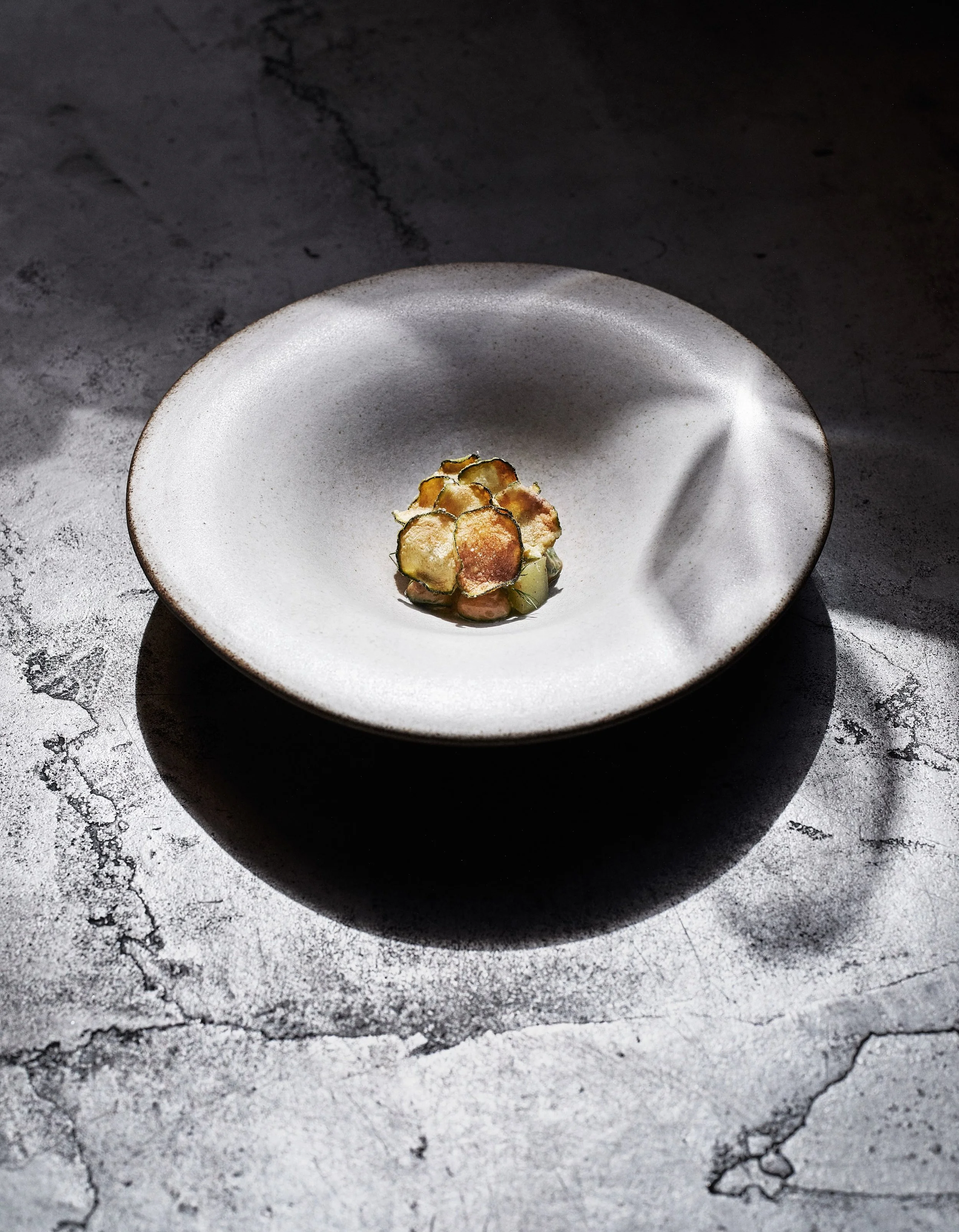 Summer squash from Linnestad Farm, grilled over open fire and seasoned with Holtefjell cheese garum. 

Served with green tomato, flowering dill, and a dusting of shoyu powder at @kontrast.oslo

A vegetarian course built around the best of the season.