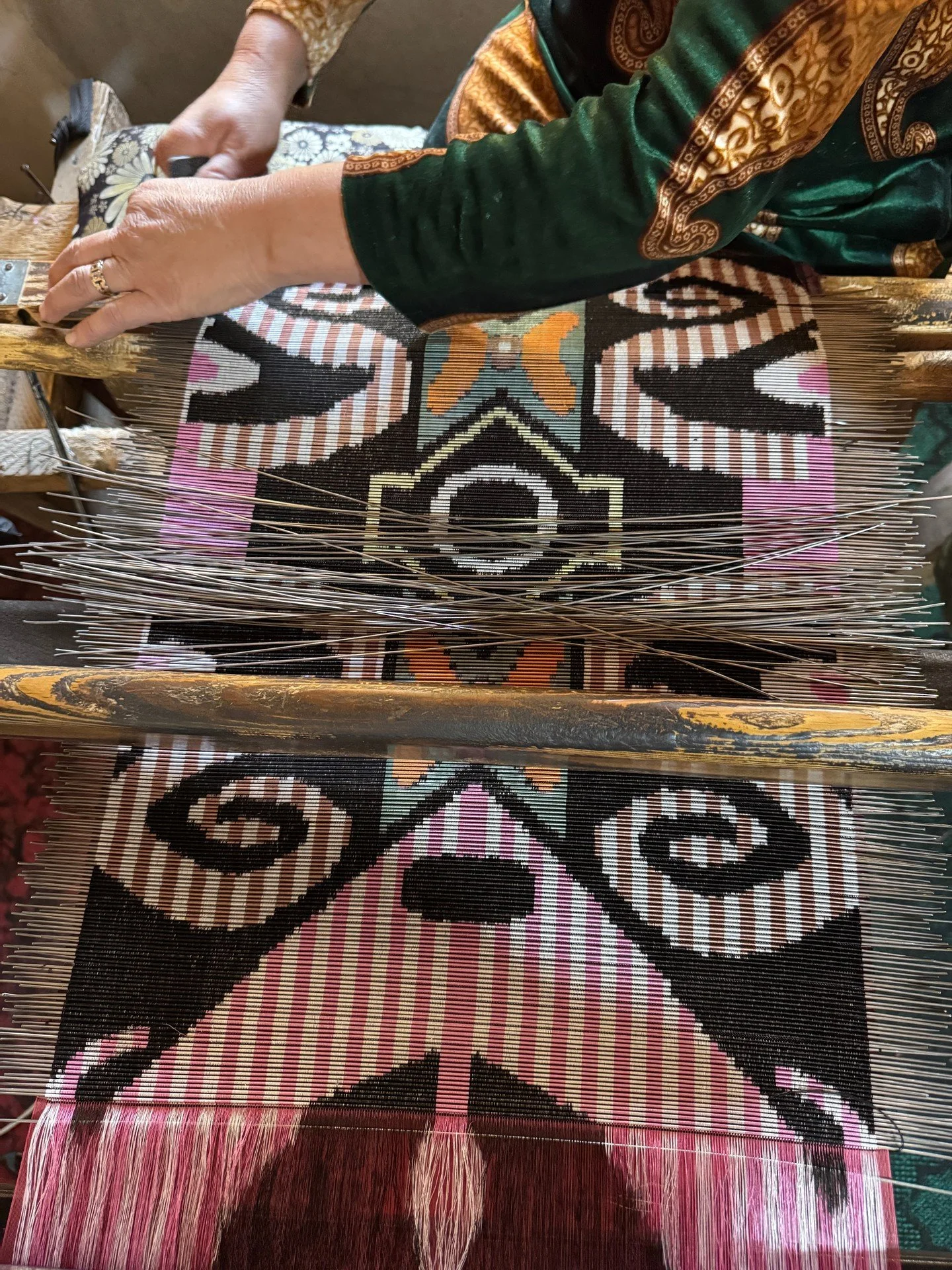 Women weavers in the Fergana Valley often work from home where they can weave in between family responsibilities. We visited the home of a weaver who makes "bakhmal", a silk ikat velvet. The pattern is created by resisting the warp threads 