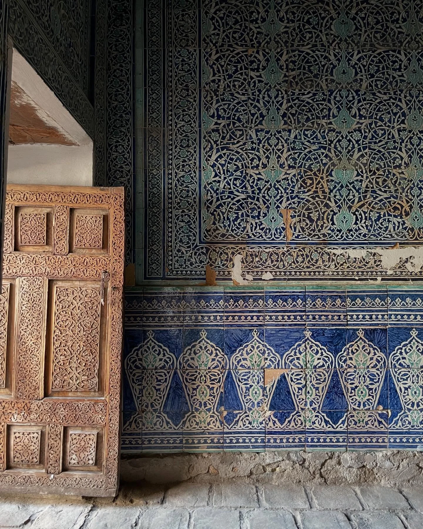 Brilliant tiles (some of which are nailed to the walls!), woodwork and painted ceilings seen inside the old walled city of Khiva. A feast for the eyes. 👀💙
.
.
.

#sustainabletravel #silkroad #afarmag #traveldeeper #uzbekistan #iamatraveler #tlpicks