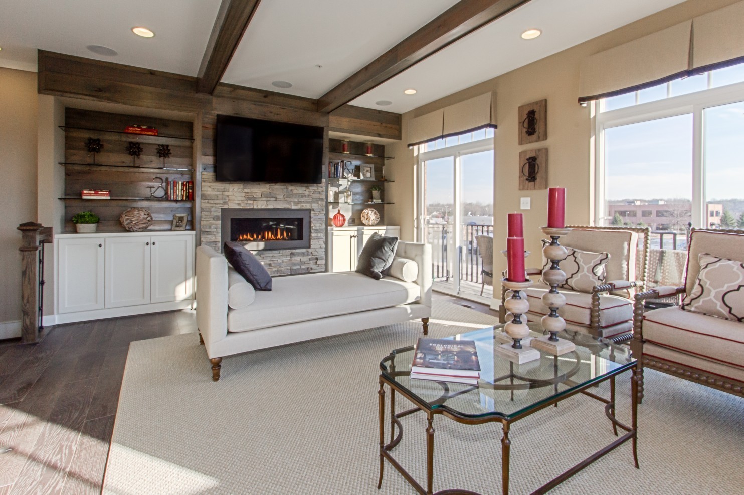 The living room features a dramatic stone fireplace. (Courtesy of Studio Trejo)