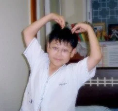 Baby James, rocking his favorite Snoopy pajama and showcasing his signature pose.