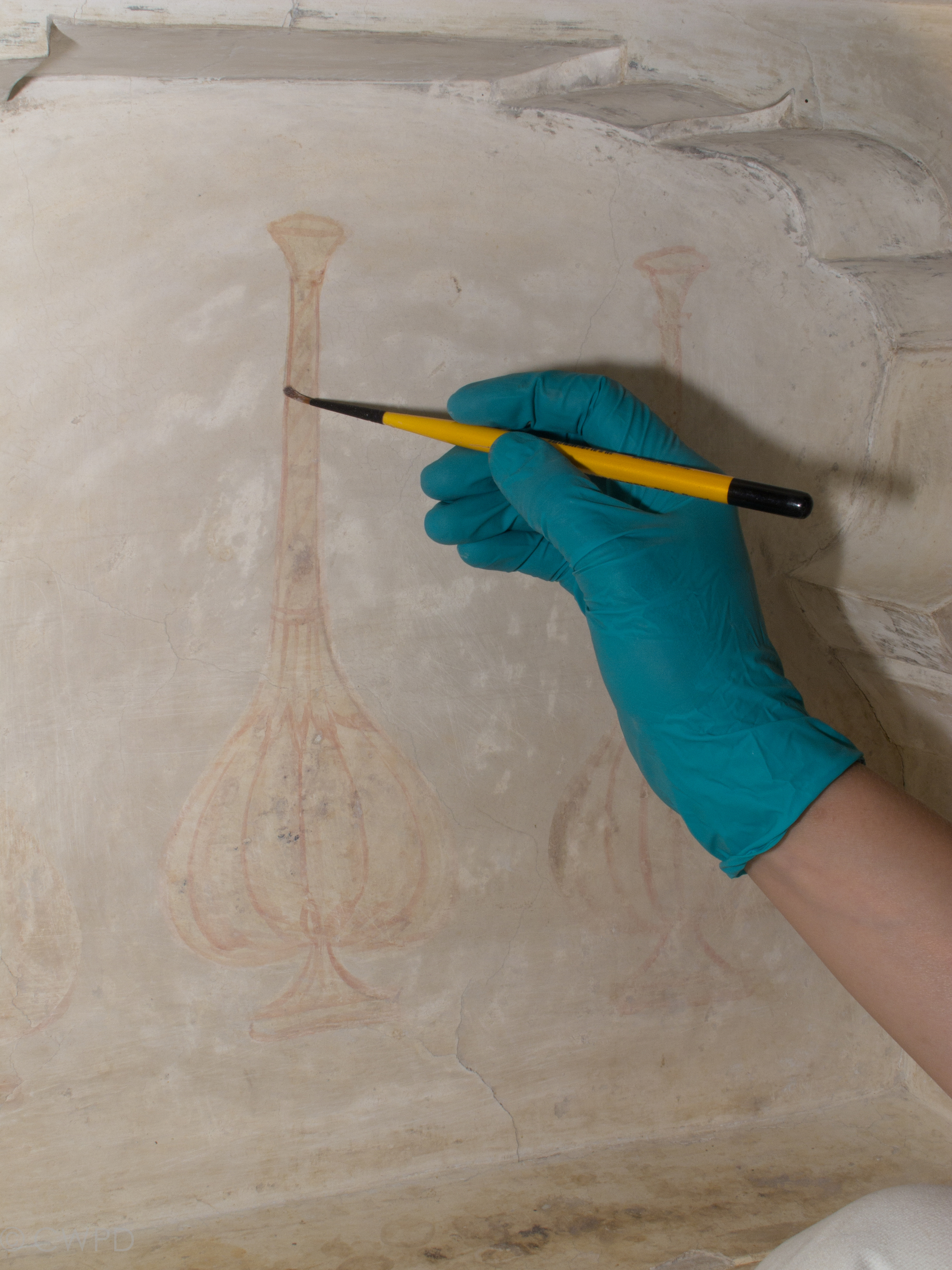  Paint layers were first covered with a naturally subliming material as protection during cleaning of the surrounding plaster.&nbsp;&nbsp;  Image © Courtauld CWPD 