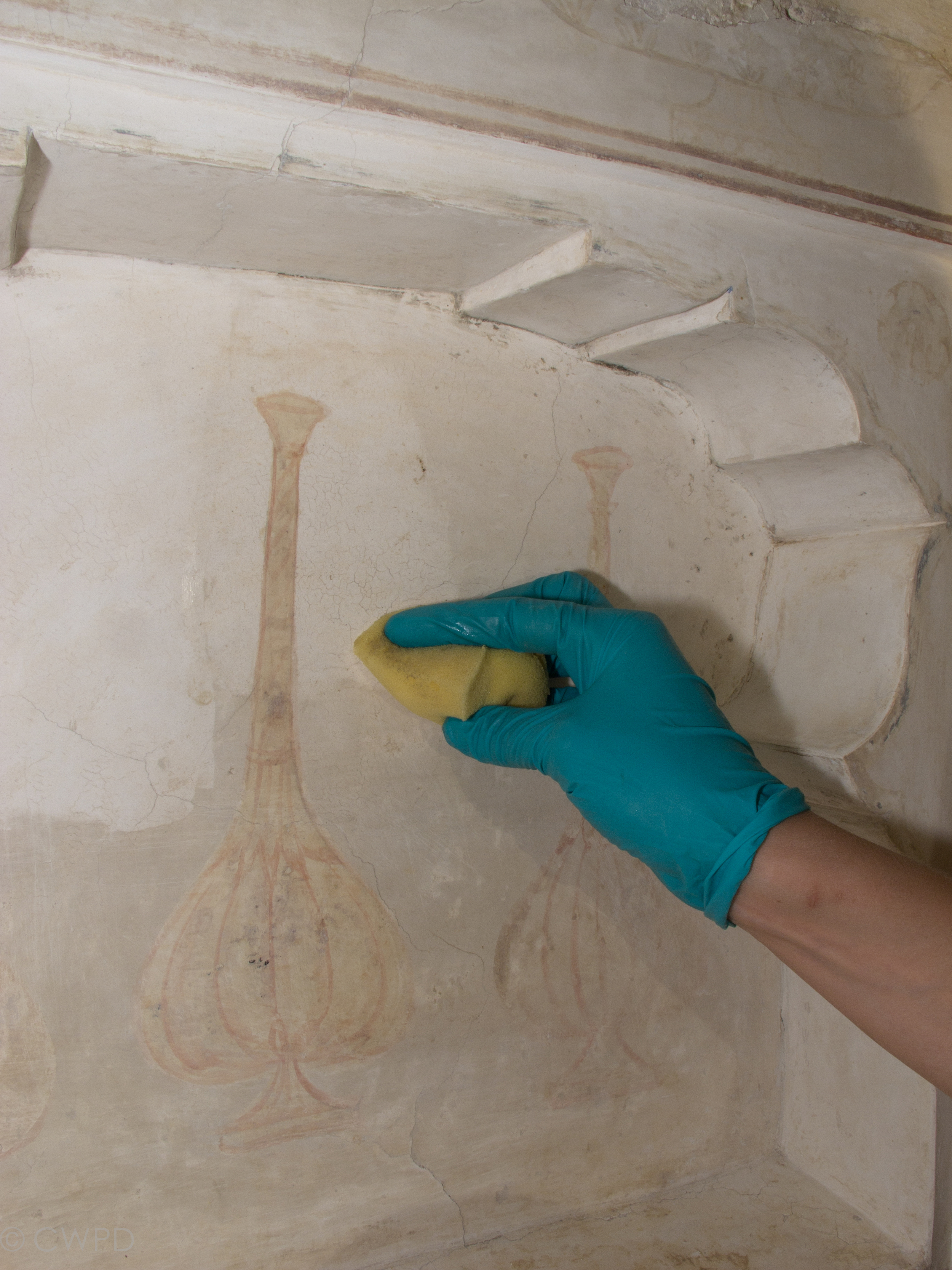  Sponges were used to clear the loosened dirt layer from the surface of the wall, leaving the painted surfaces unaffected.&nbsp;  Image © Courtauld CWPD 