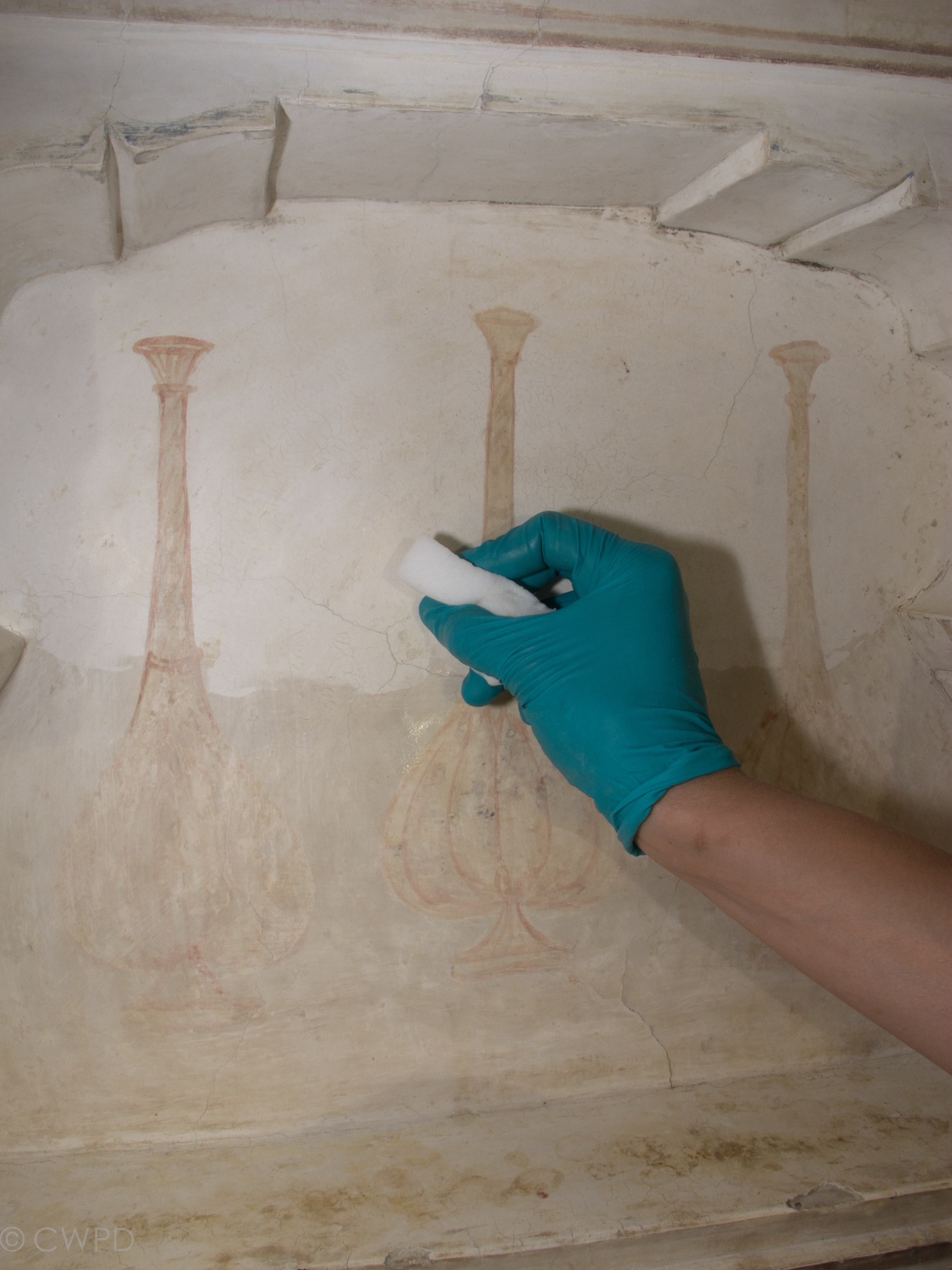  Sponges were used to clear the loosened dirt layer from the surface of the wall, leaving the painted surfaces unaffected.&nbsp;  Image © Courtauld CWPD 