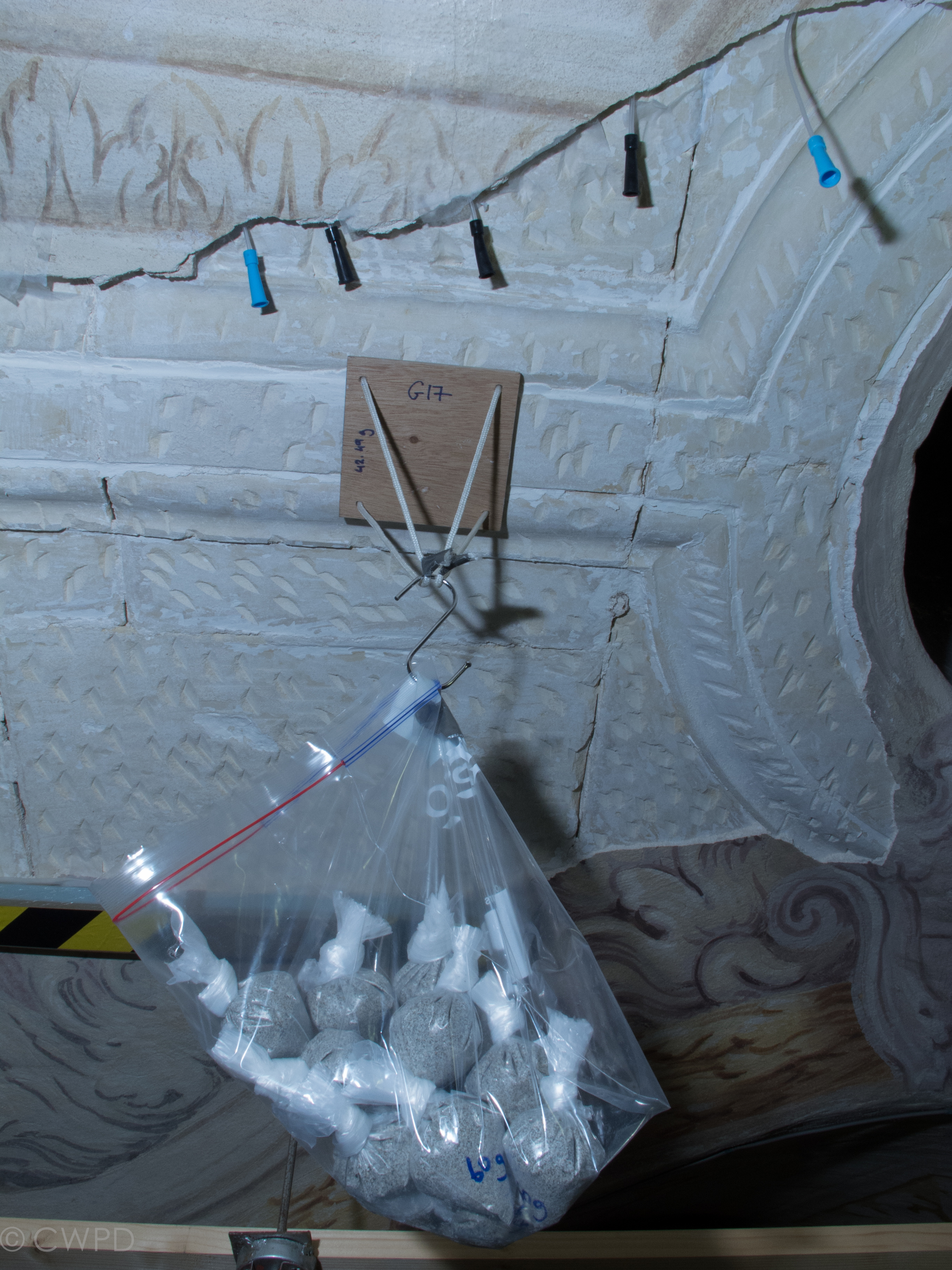  Testing the strength of a custom grout for stabilization of the detached plaster.  Image © Courtauld CWPD 