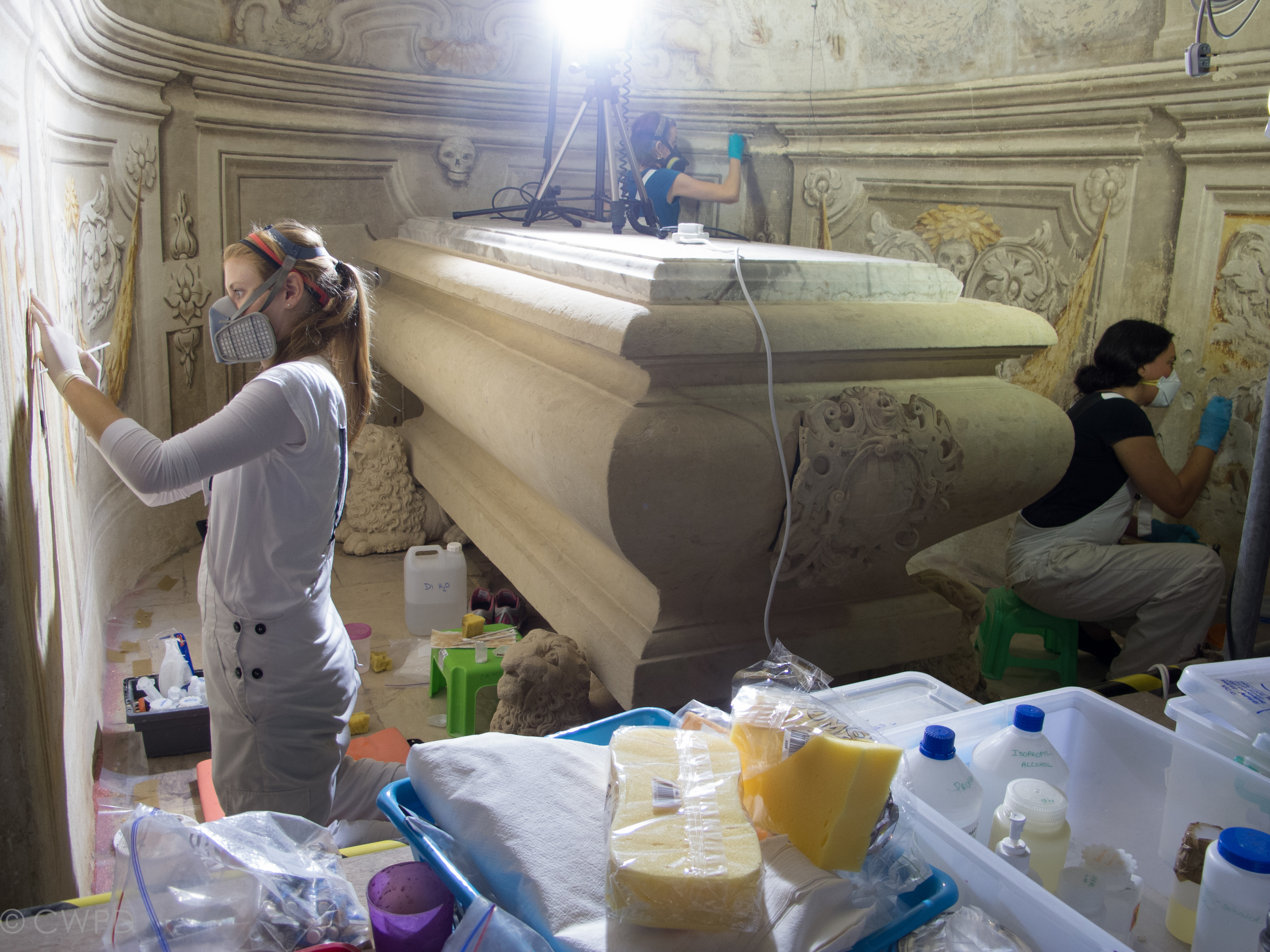  Salt efflorescence, loose dirt, and microbiological growth were cleaned from the wall paintings by dry dusting with paint brushes and carefully wiping with damp sponges.&nbsp;  Image © Courtauld CWPD 