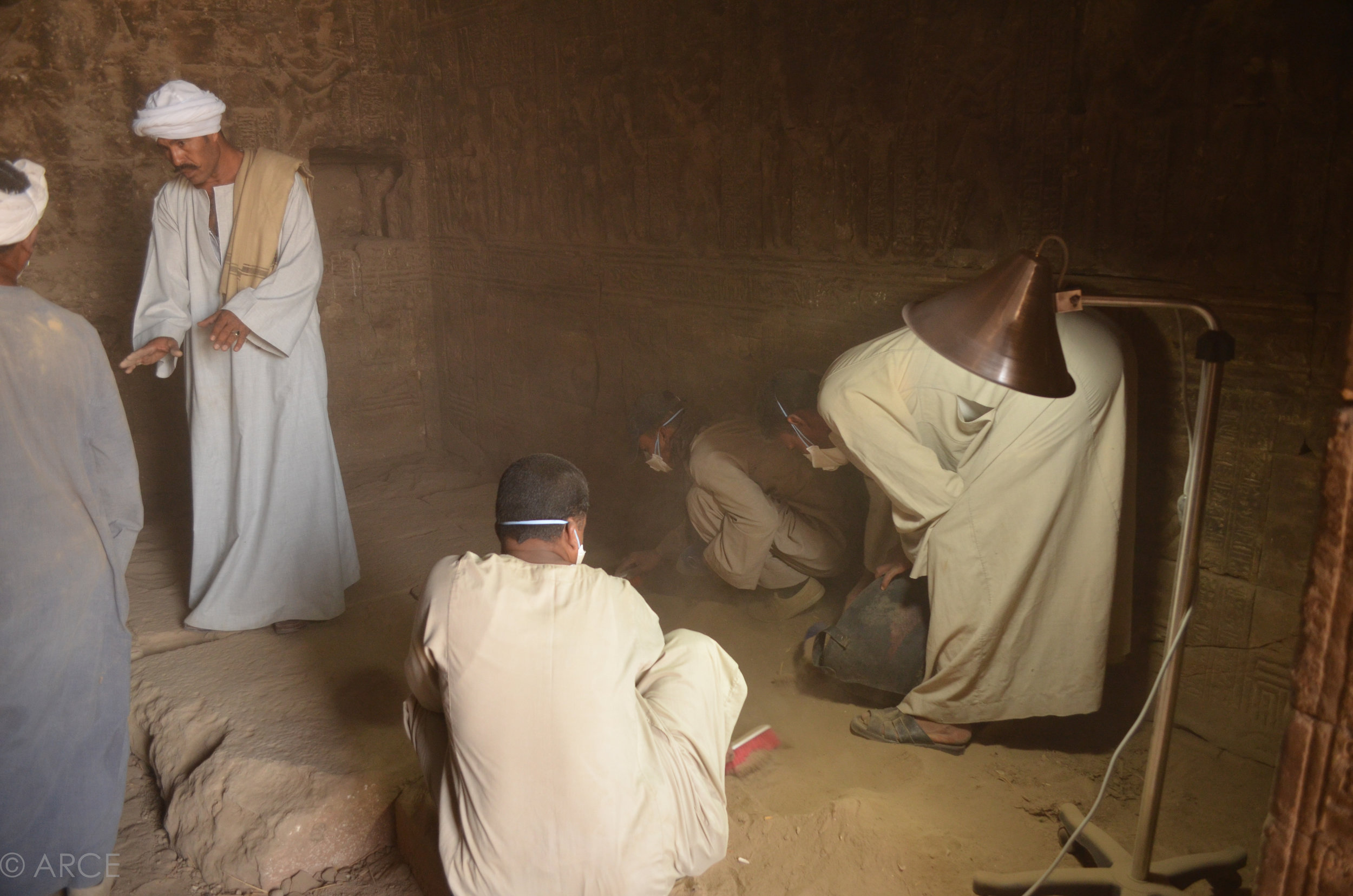  Once the bats had been permanently excluded, thick deposits of dust and guano were removed from the ﬂoors of the temple. All debris was reviewed for archaeological material before disposal.&nbsp;  Image © ARCE, 2012 