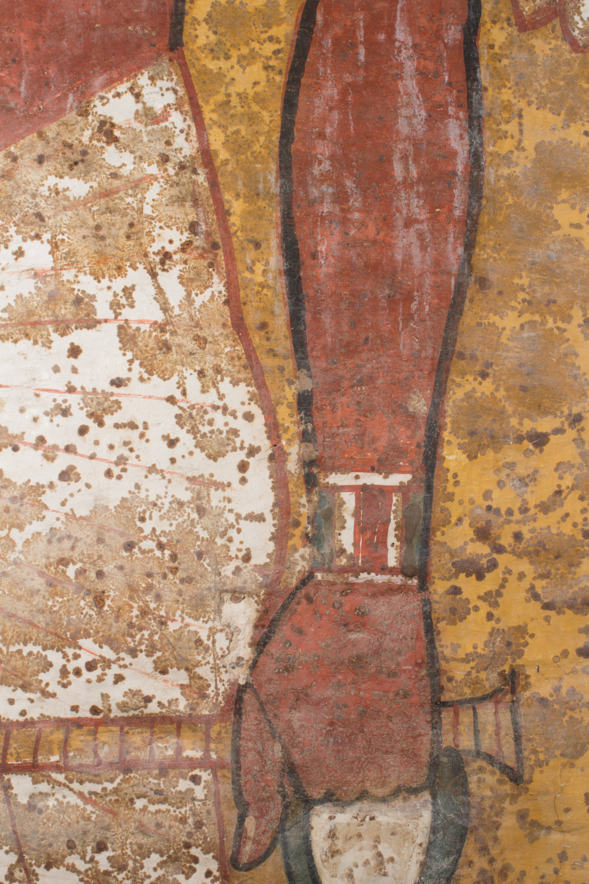  Multiple layers of non-original coatings and drips from previous interventions covered the surface of the wall paintings prior to treatment. The coatings were extremely glossy in some areas while some drips had blanched.&nbsp;  Image © J. Paul Getty