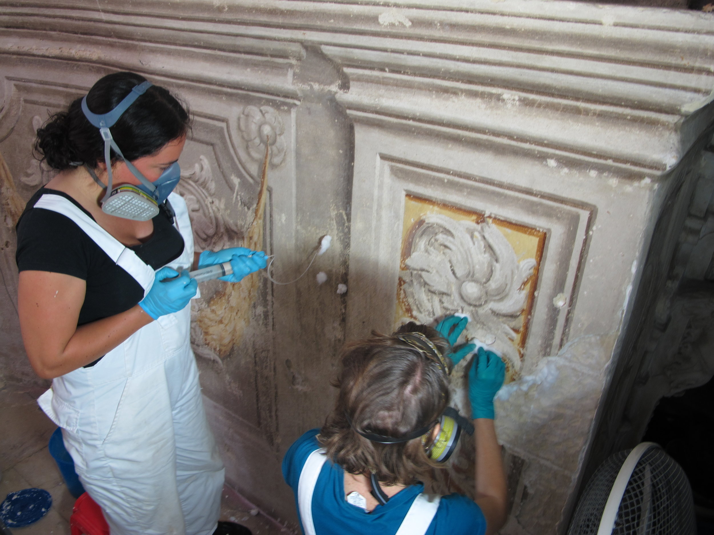  Syringes, catheters, needles and pipettes were used to inject a custom grout into voids behind detached areas of decorated plaster.&nbsp;  Image © Courtauld CWPD 