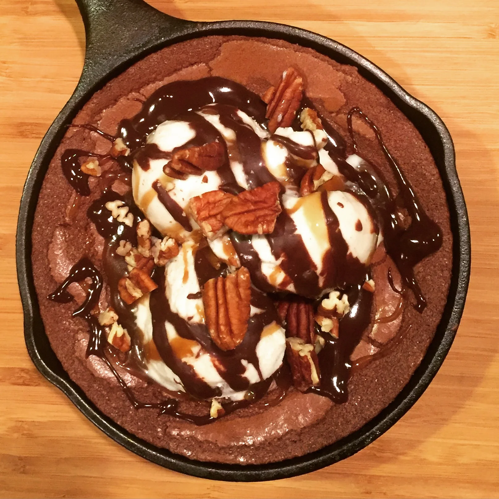 Easy salted caramel sauce is perfect for turtle-style skillet brownies.