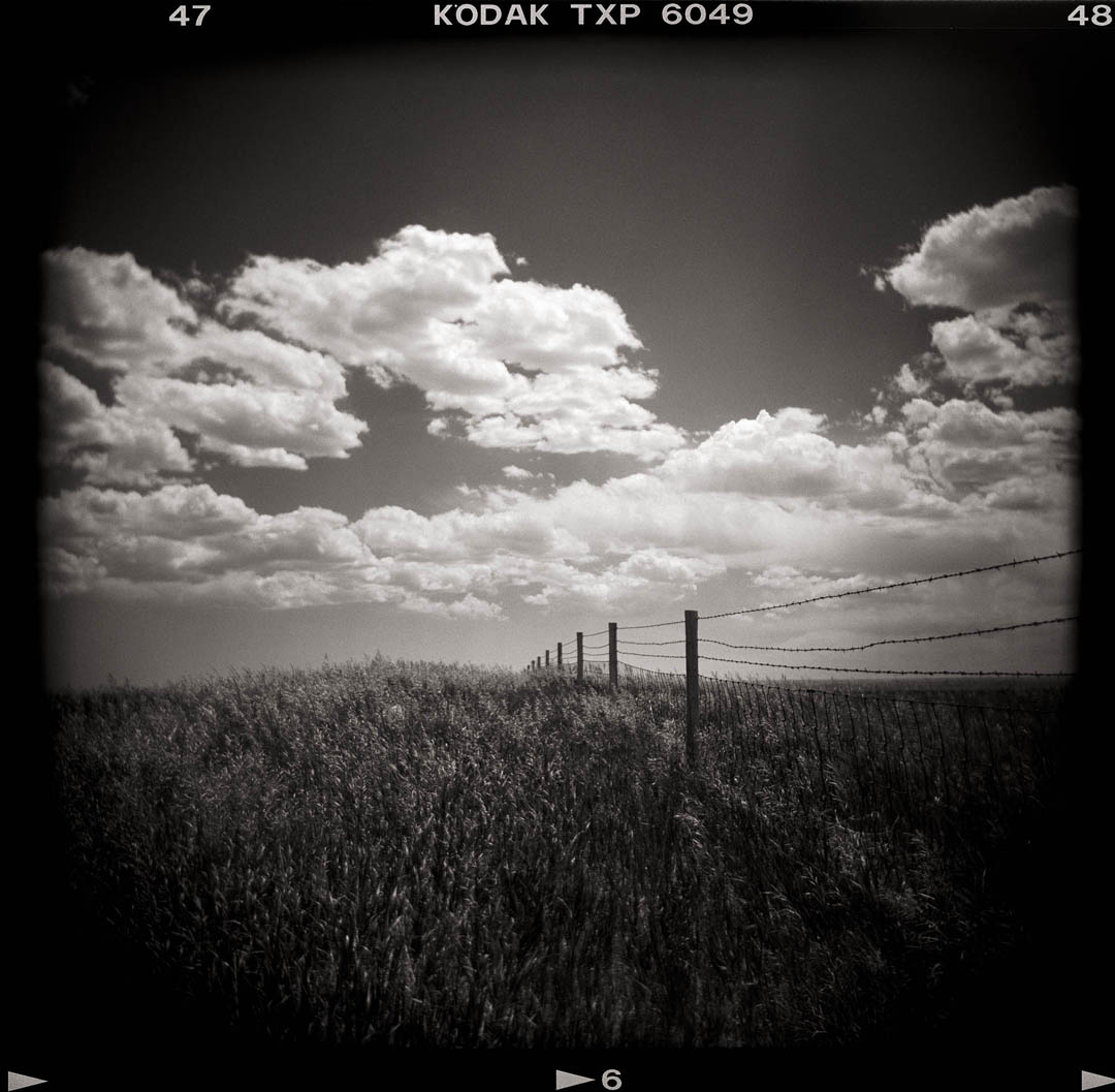 Fence and Clouds, Wyoming
