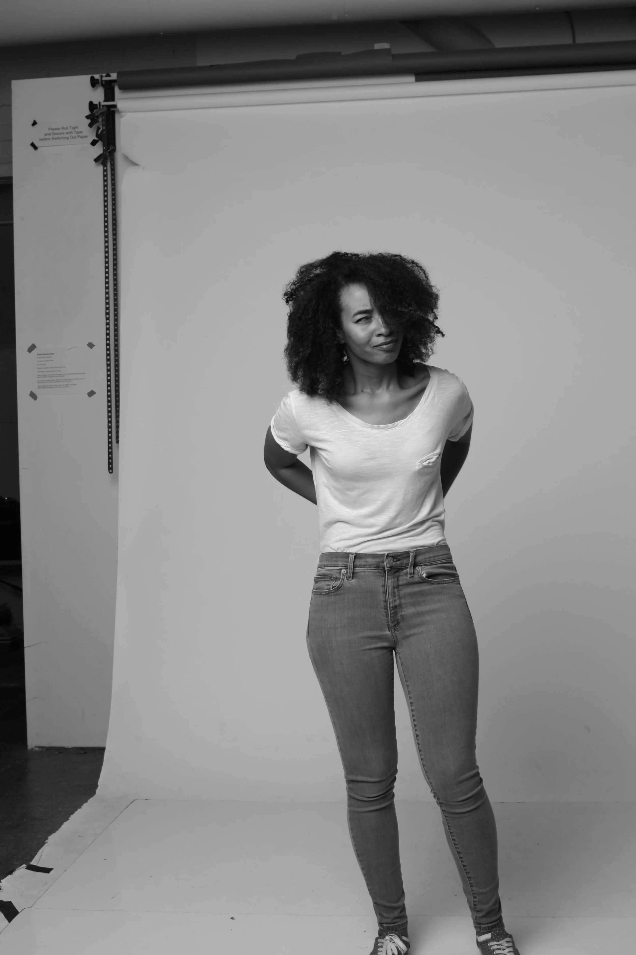 Me in my natural habitat sporting a basic white t-shirt, the one pair of guess jeans that ever fit me ever and I'll never throw them away, and the face I make when someone says something stupid. Also featured in this picture is my afro doing whatever it wants. 