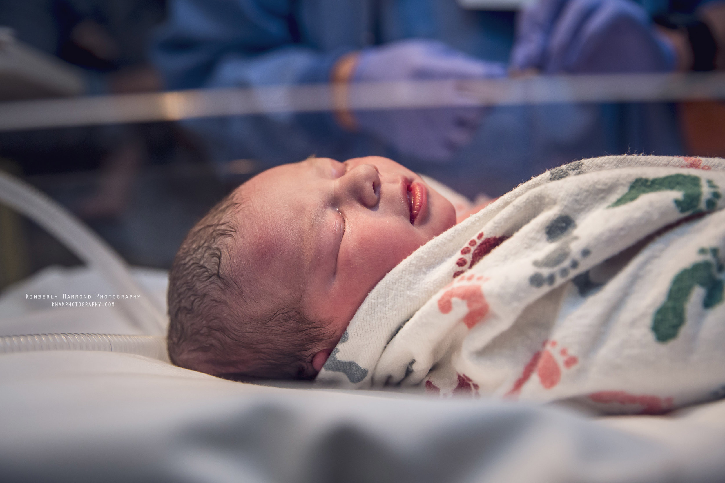 Baby lays in warmer after birth at Harris Methodist in Fort Worth, TX.