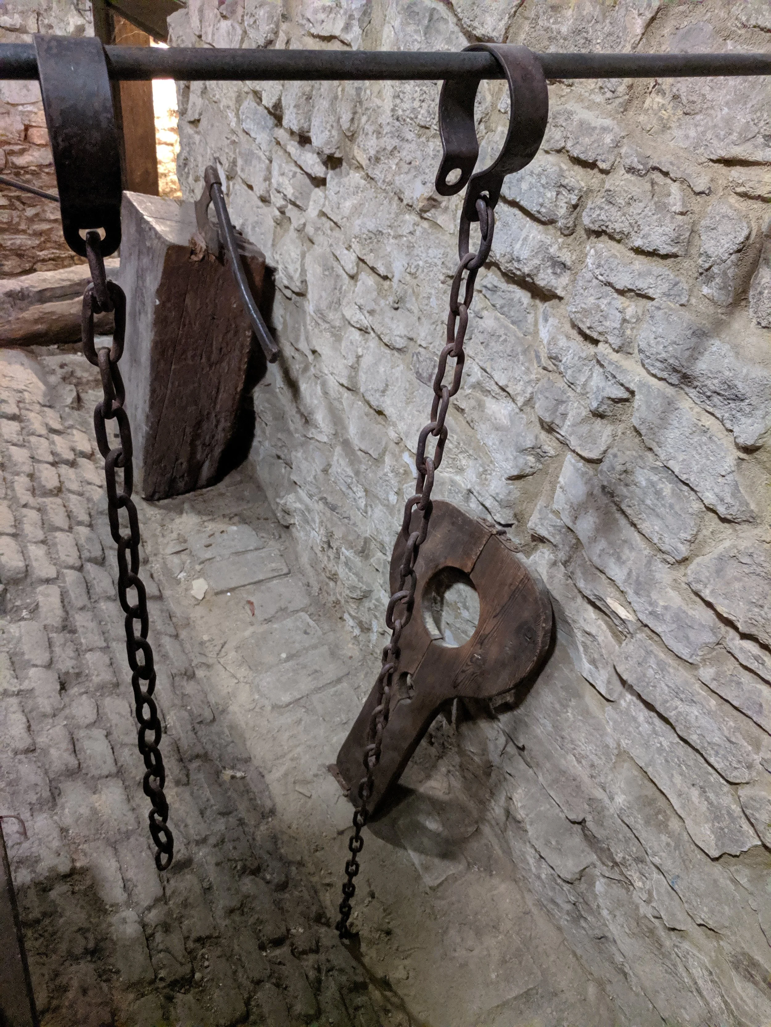Prison under Prague Town Hall and original implements used for penal punishment in the era of Jan Hus.