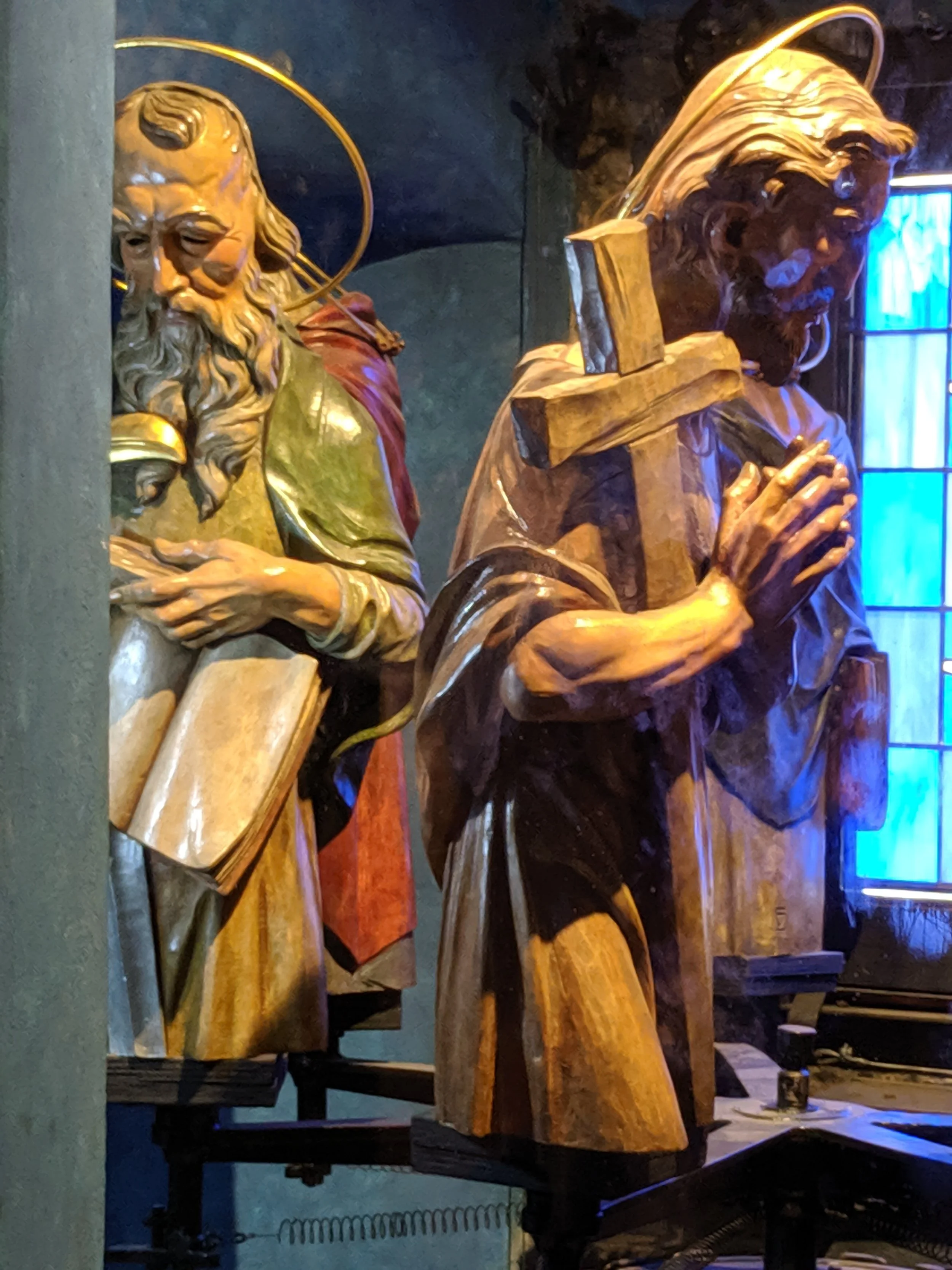 The hand carved moving apostles, seen from inside the clock mechanism. They appear in the two small windows at the apex of the clock.