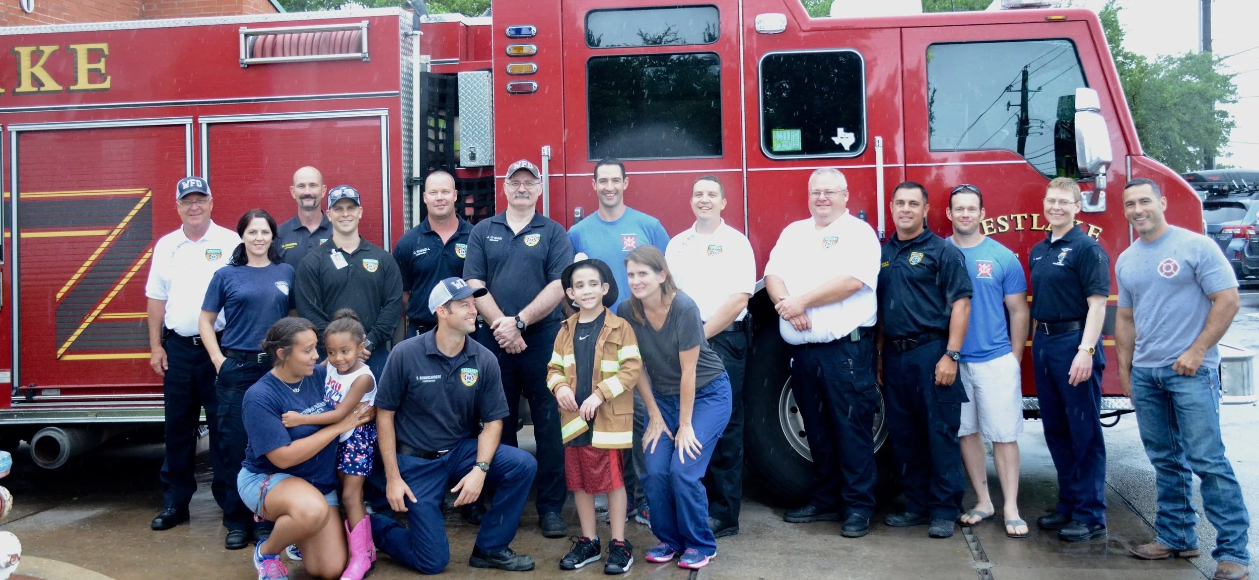 Members of the Westlake Fire Department helping with Make-A-Wish.