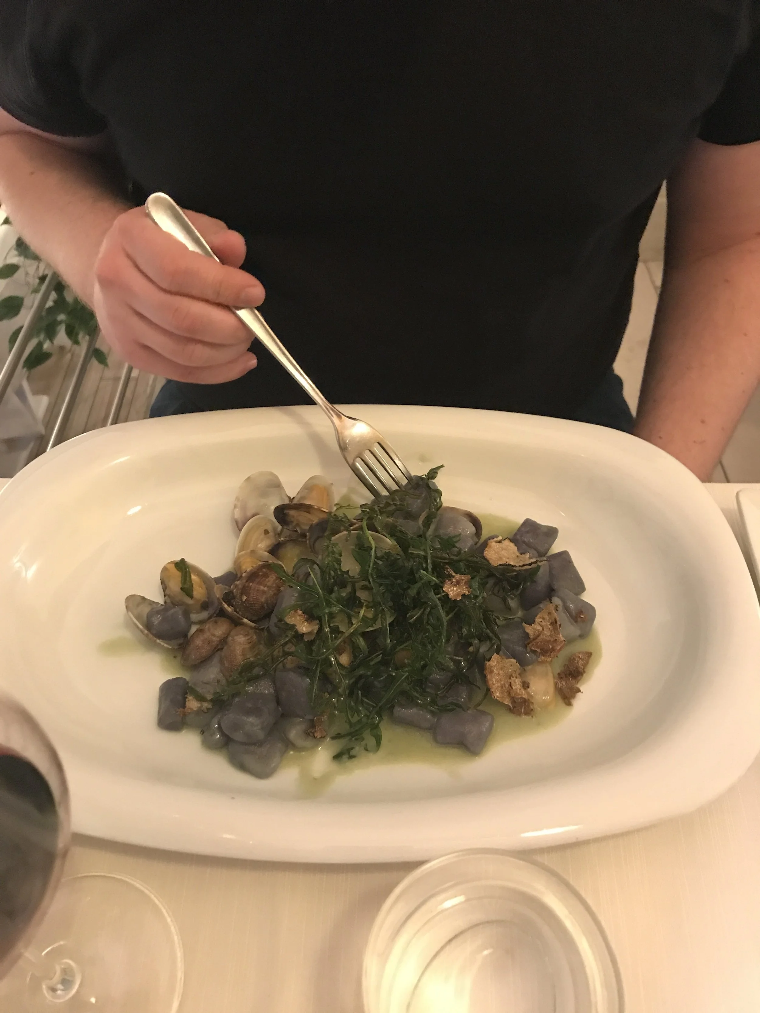  Purple gnocchi with clams, black truffles, and fried arugula (rocket) salad. We learned that gnocchi is purple when it's cooked in squid ink. 