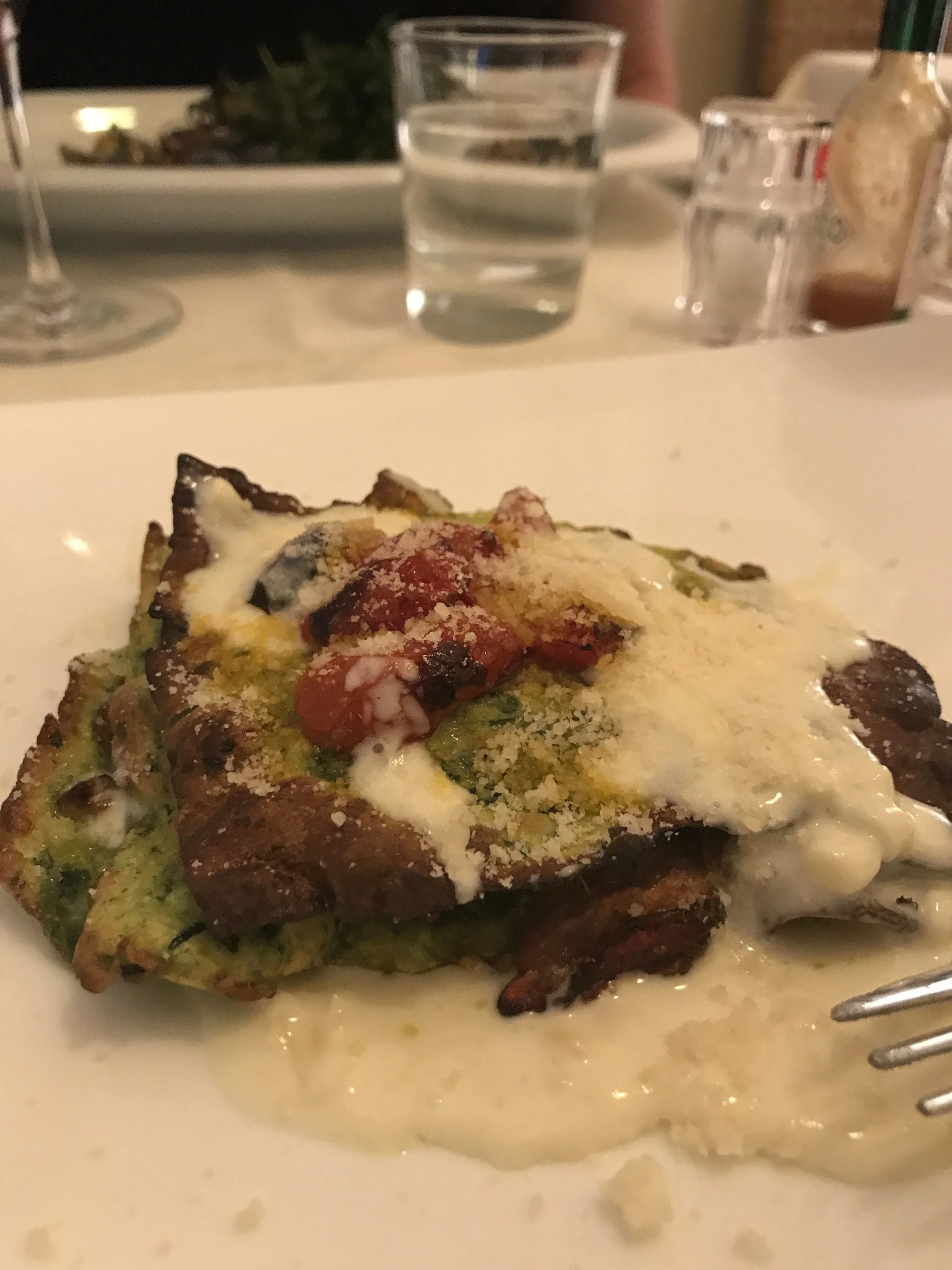  First course: a vegetarian lasagna with vegetable tartare and creamy goat cheese. 