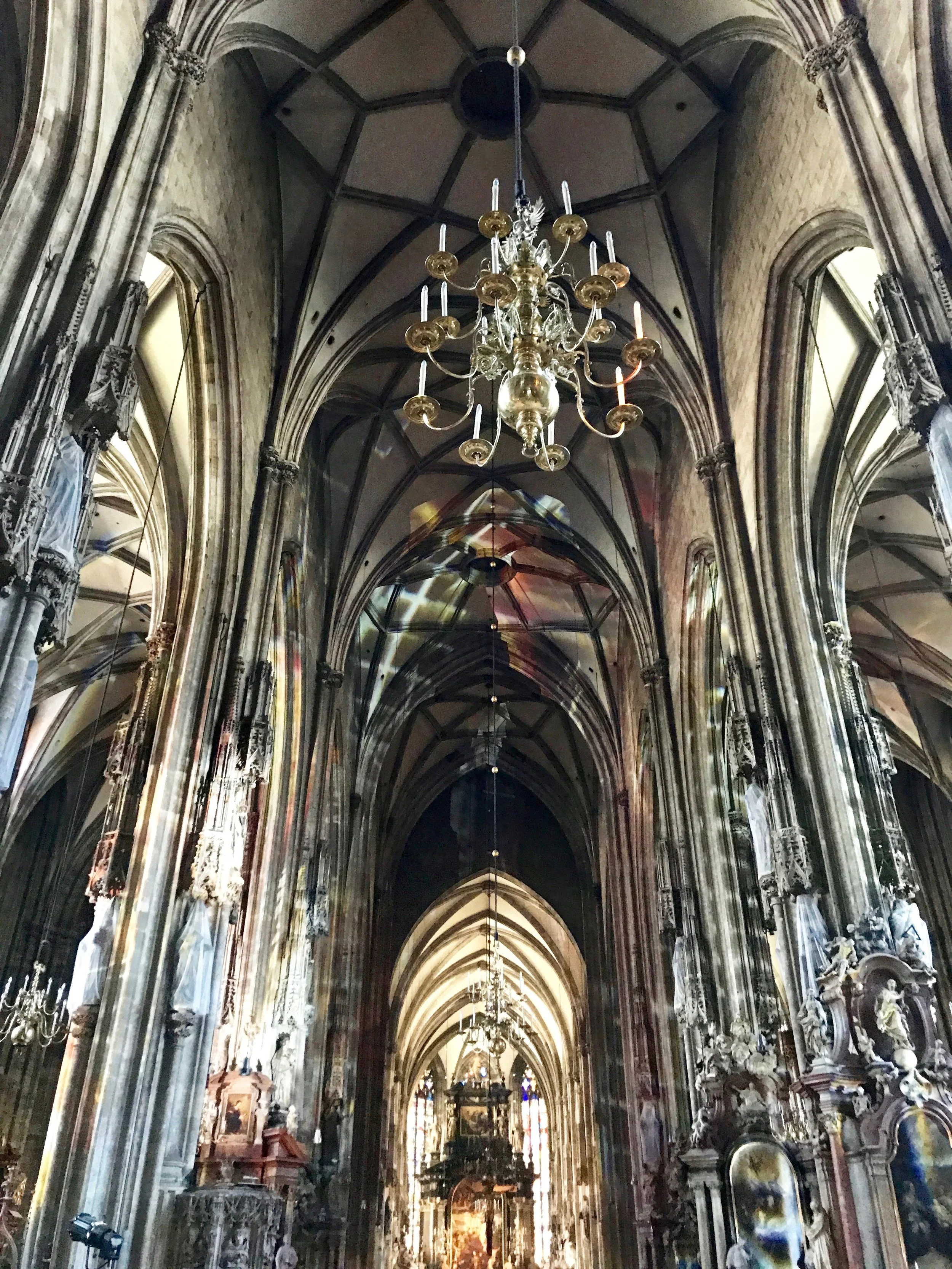  St. Stephan's Cathedral—culturally considered the center of Vienna. Locals explained that a common meeting place for all ages is the Stephansplatz, the large cobbled plaza in front of the cathedral that's now crawling with men in Mozart costumes, tr