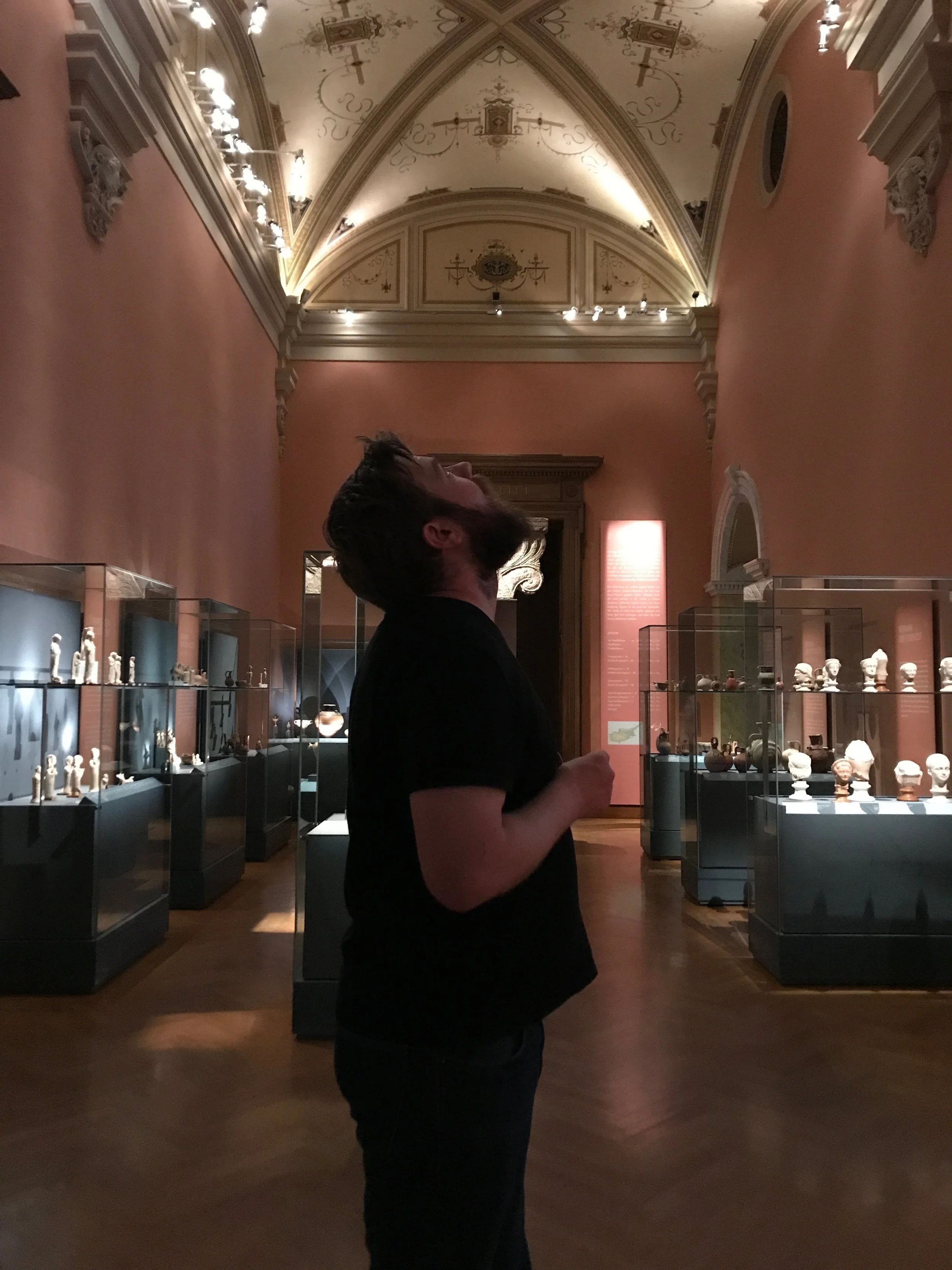  By that point in the day, our lower backs were aching so badly from walking so slowly through museum after museum that we stretched out on the lawn in front of this building, right in the shade of a massive, tear-shaped shrub for a full hour. It was