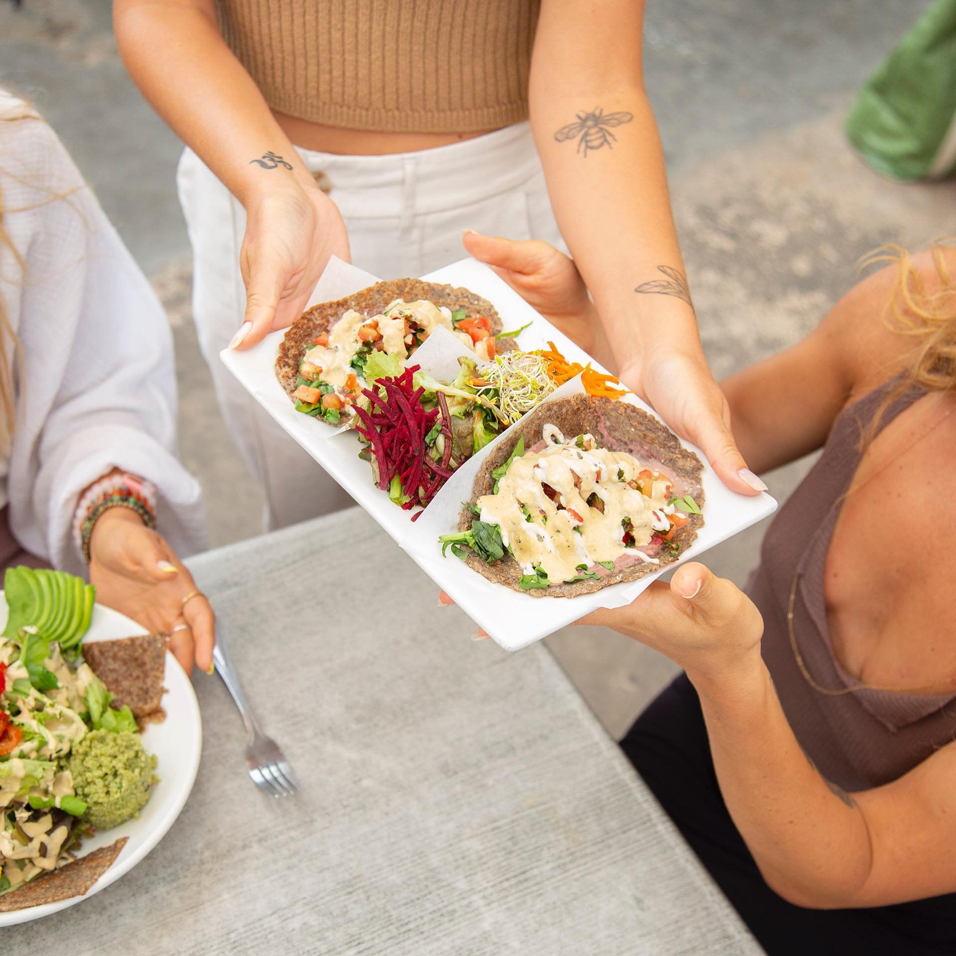 Our high vibrational cafe serves up organic, vegan, gluten-free delights that will tantalize your taste buds and nourish your soul. From mouthwatering tacos to colorful salads to hearty grain bowls, every bite is a celebration of health and happiness