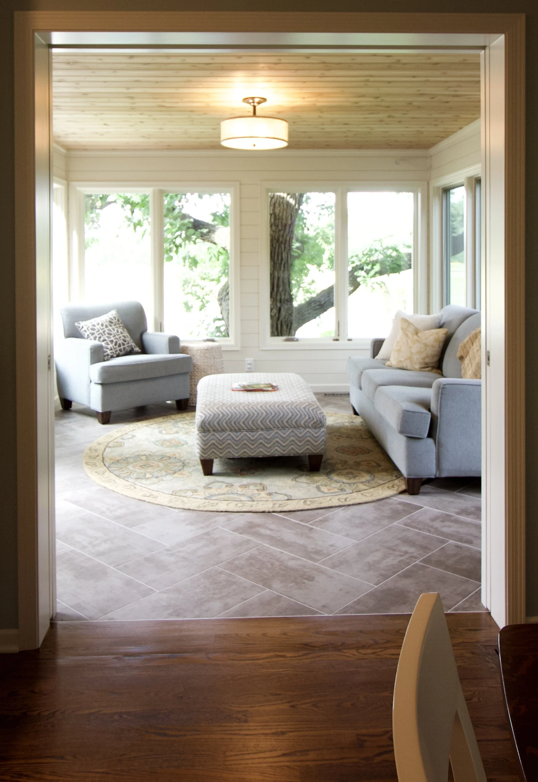  After: By replacing the sliding doors with pocket doors the spaces now flow seamlessly into each other. 