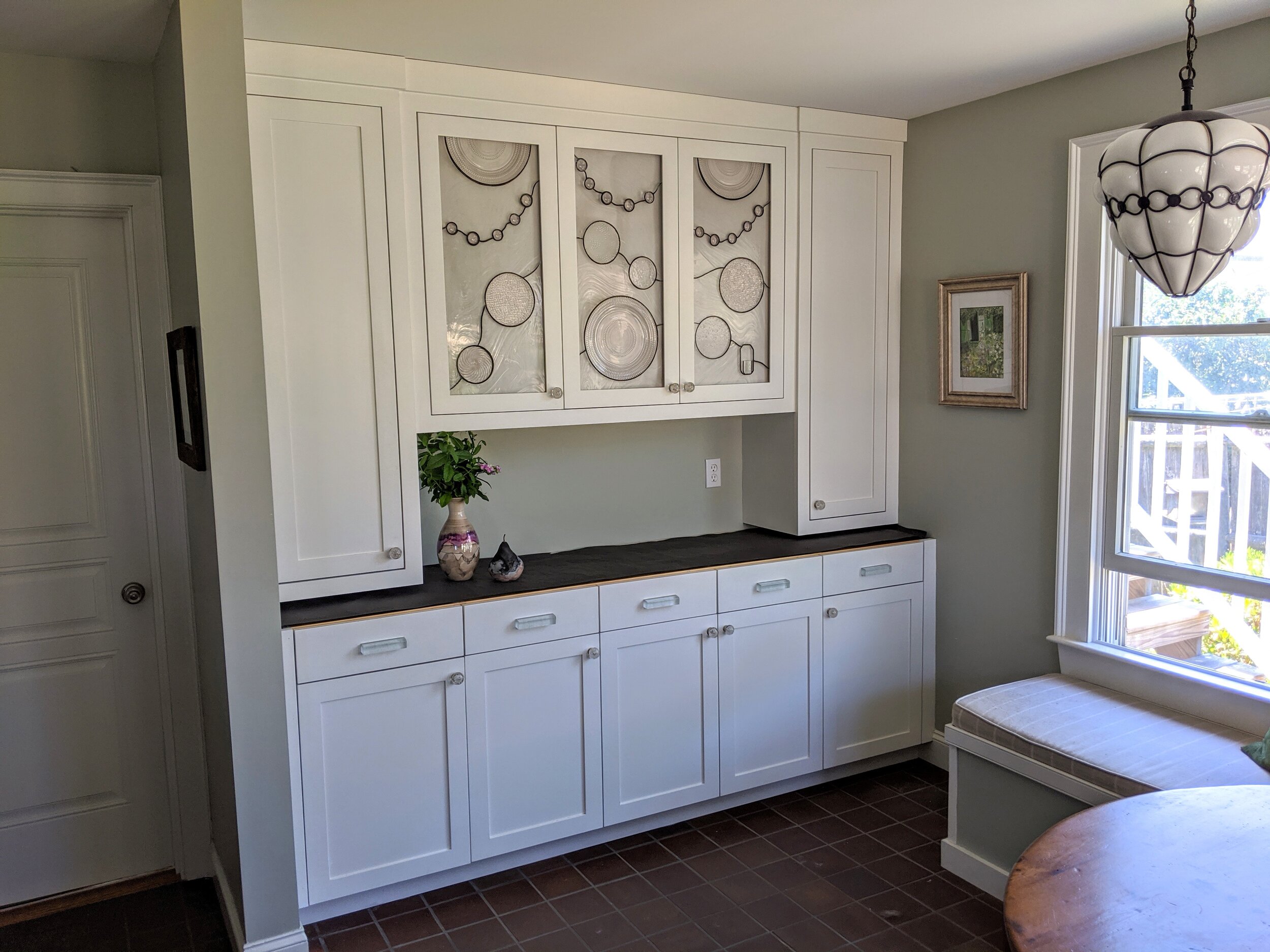 Kitchen Built-In Glass Panels and Custom Drawer Pulls
