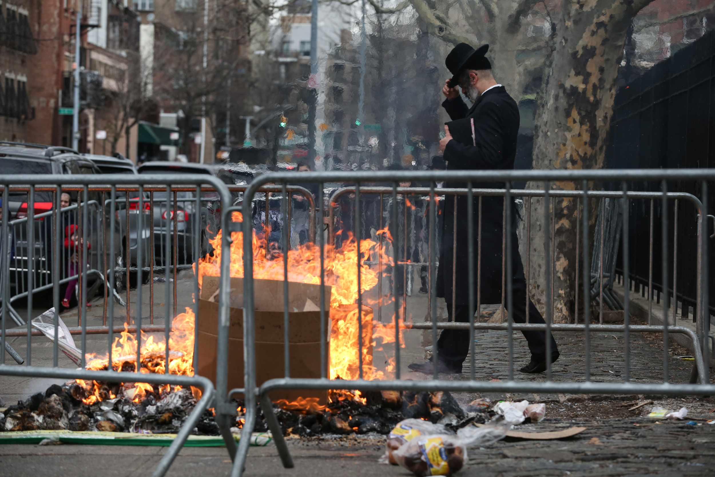  A Hasidic man prays during "The Burning of the Bread" marking the start of Passover 