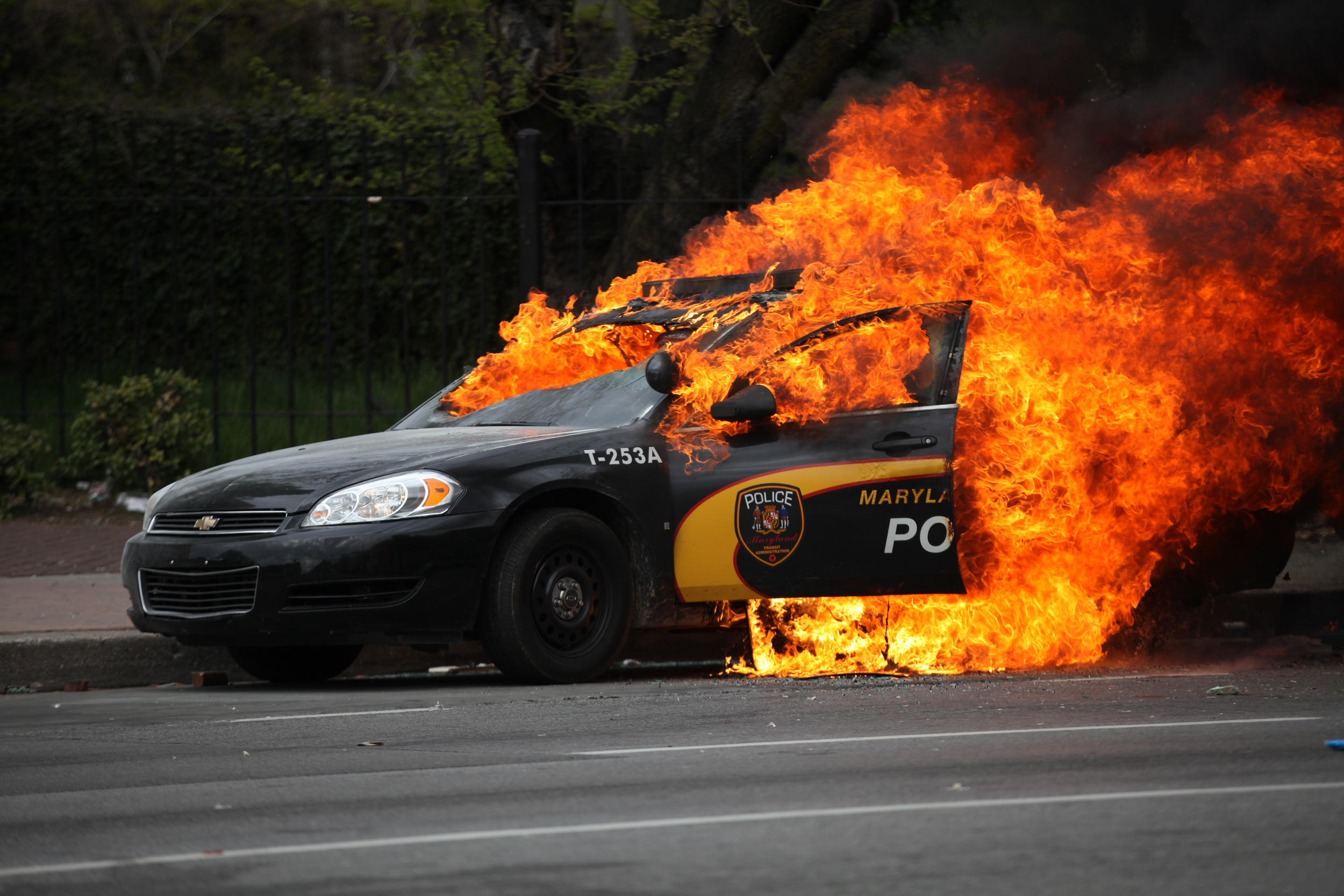  A Baltimore police car is set on fire during a riot after the killing of Freddie Gray by police 