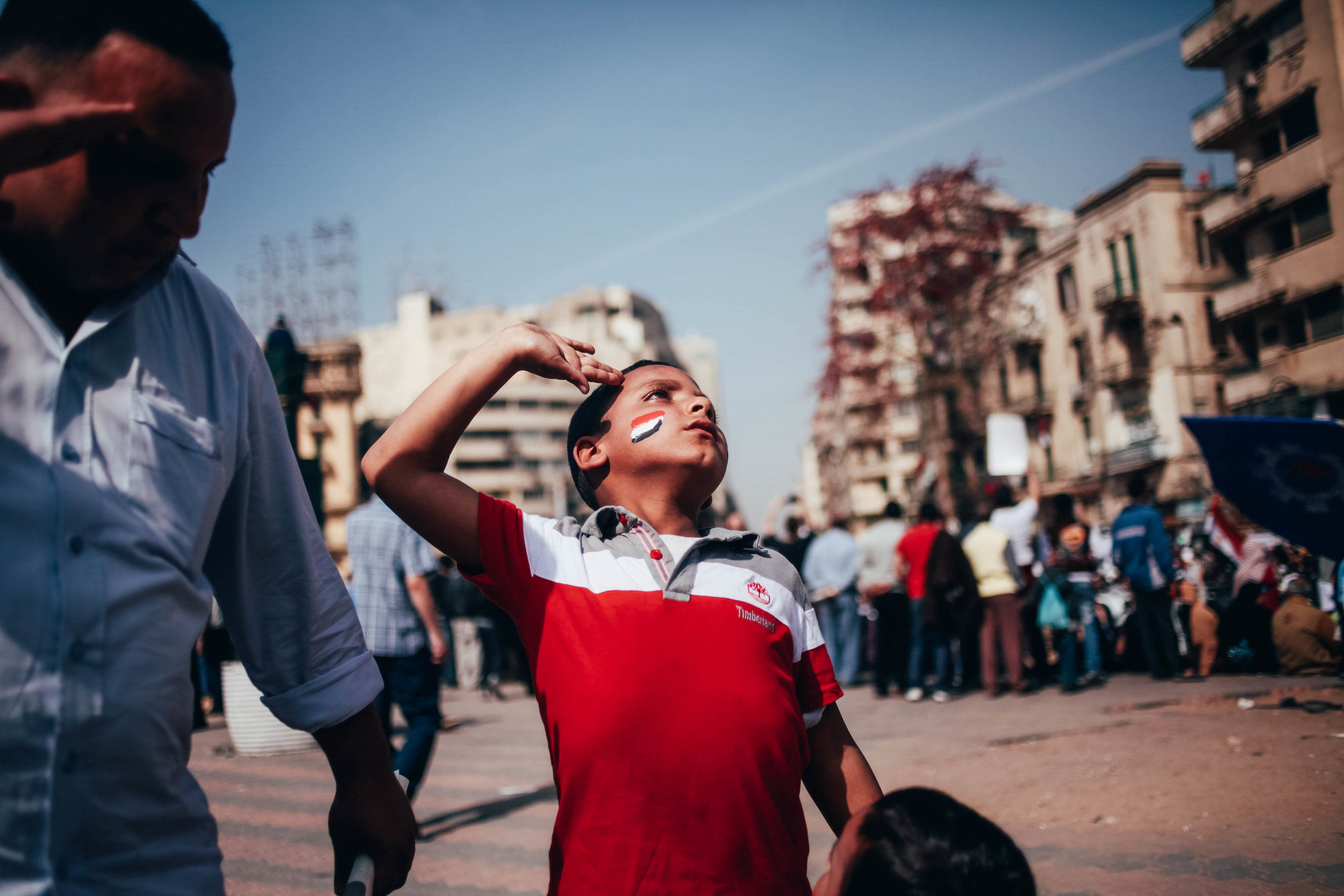  A boy salutes during a protest in Tahrir Square, Egypt during the Arab Spring 