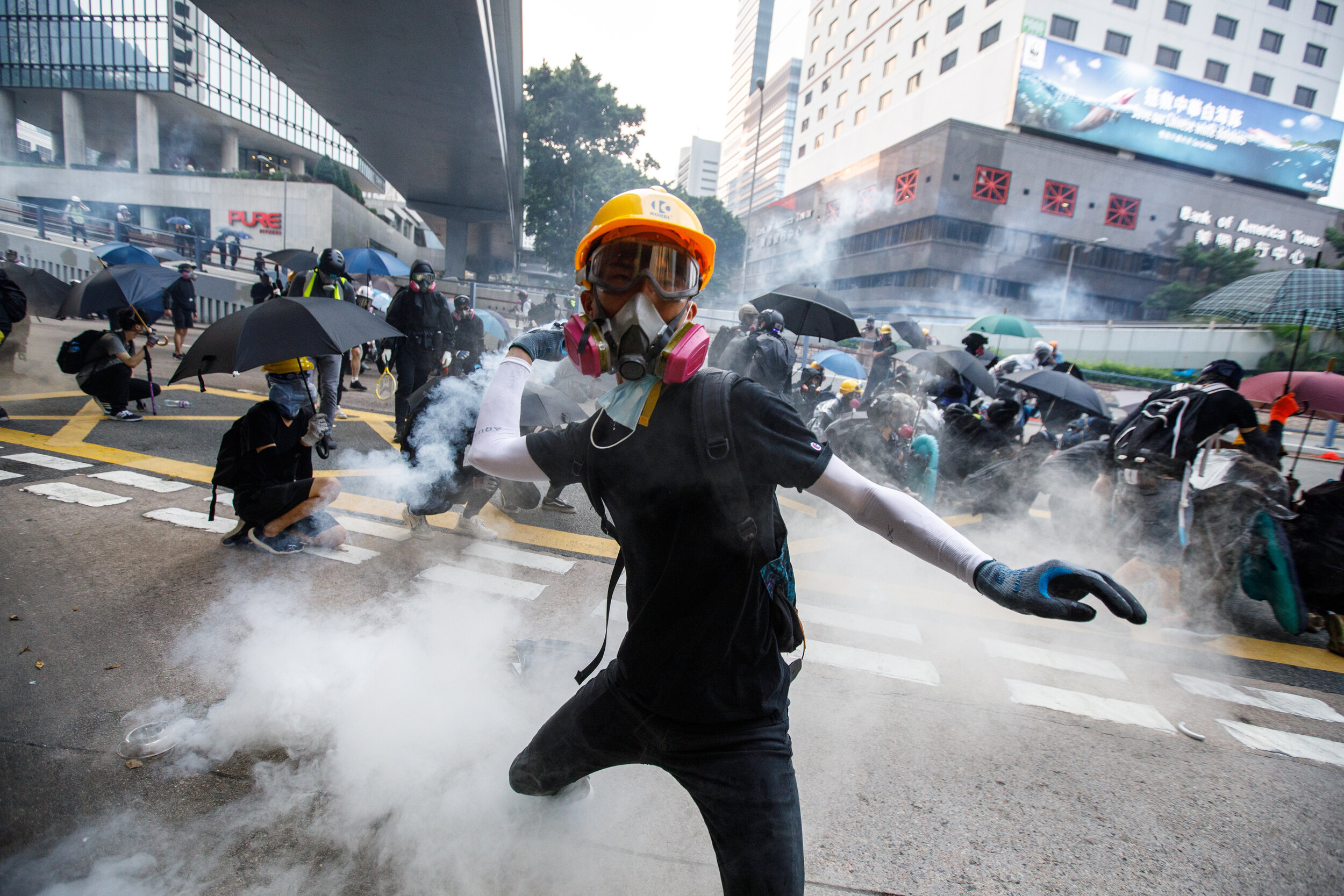  A protester throws back a tear gas canister in Central, Hong Kong 