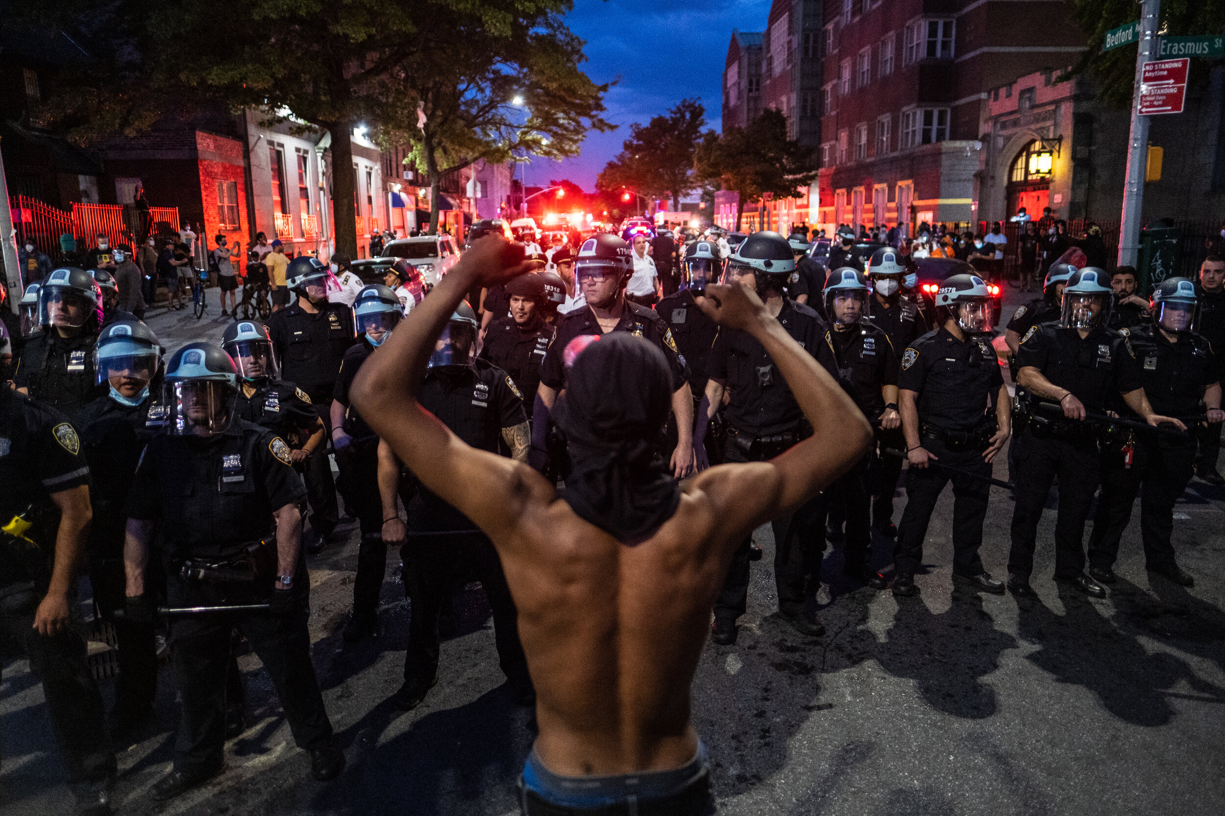 May 30, 2020: New York, NY -   Protesters clash with NYPD officers  in Flatbush, Brooklyn after George Floyd was killed while being detained by Minneapolis police on May 25.  