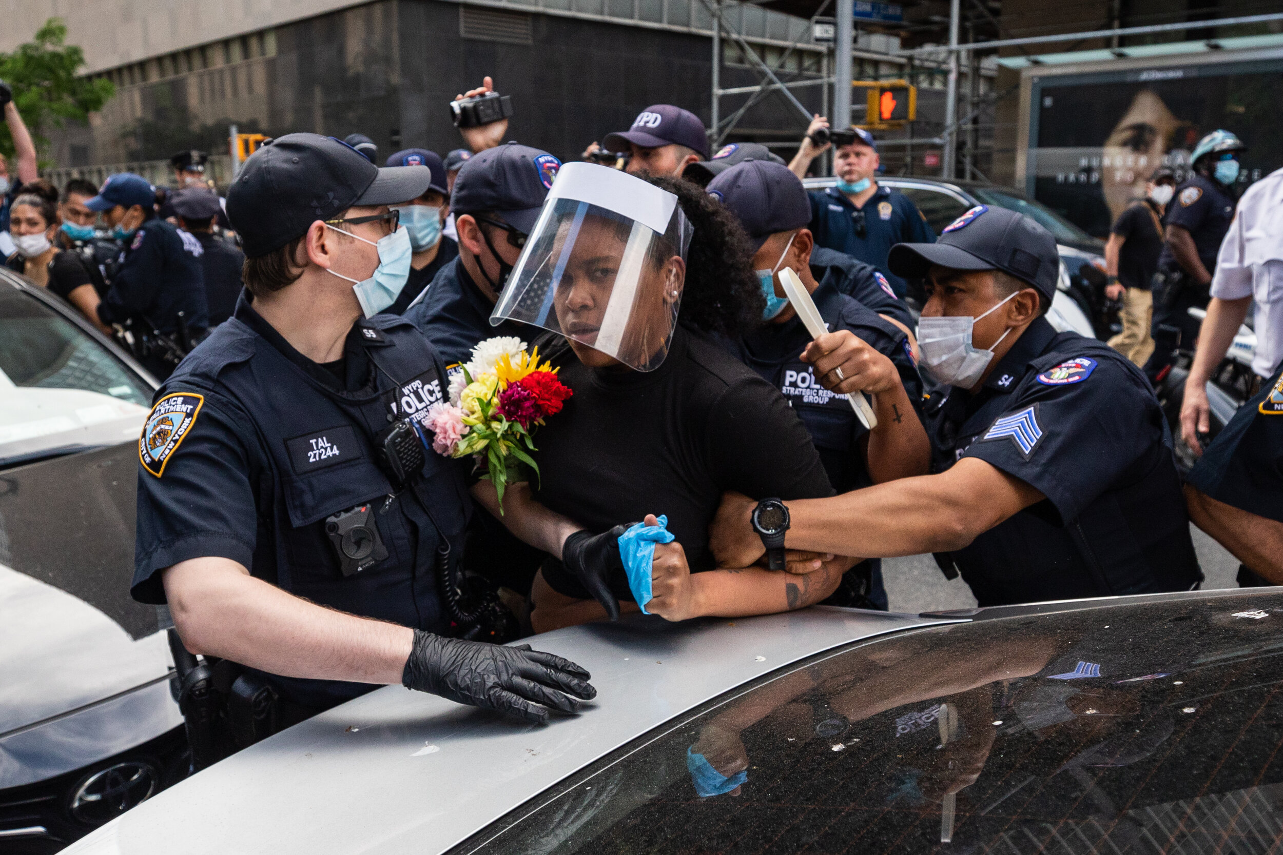  May 29, 2020: New York, NY -   A woman is detained as protesters clash with NYPD officers near Foley Square after George Floyd was killed while being detained by Minneapolis police on May 25.  