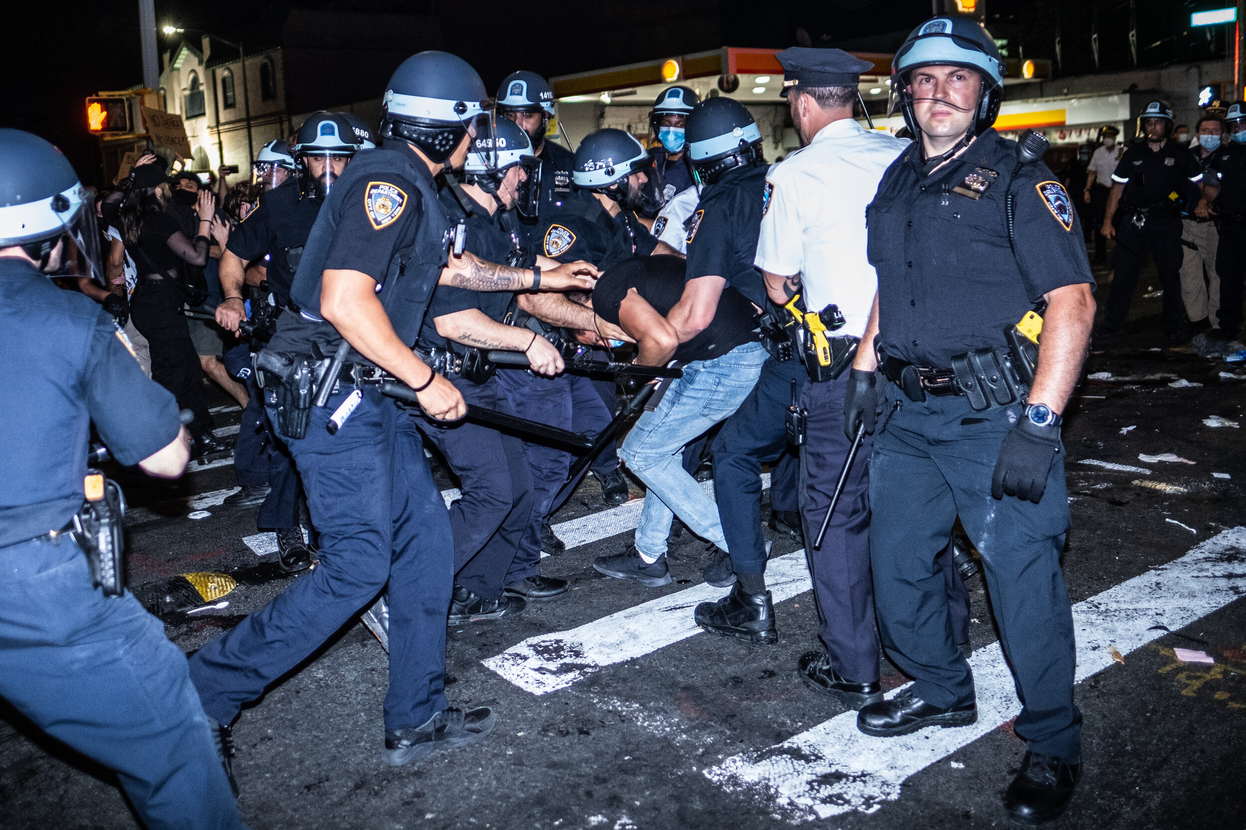  May 30, 2020: New York, NY -   A man is detained as protesters clash with NYPD officers in Flatbush, Brooklyn after George Floyd was killed while being detained by Minneapolis police on May 25.  