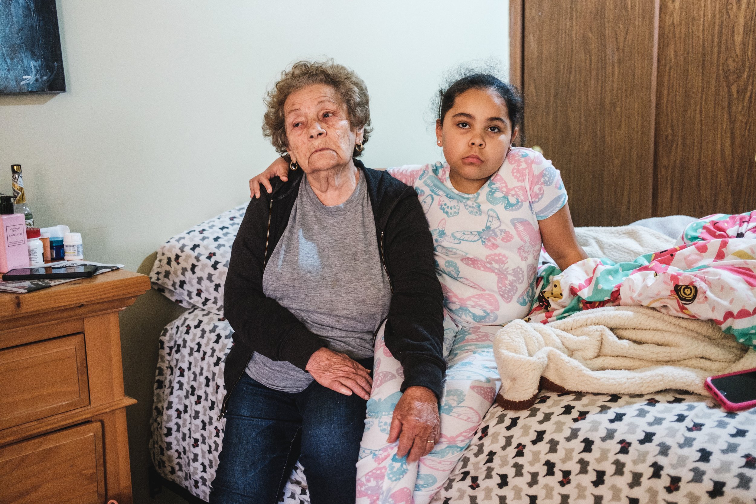  December 24, 2021 - Bronx, NY:  NYCHA resident Margarita Pabon, 83, and her great grand daughter Leahany Reyes, 7, in Pabon’s apartment which has no heat. Pabon’s apartment building at the Bronx River Houses in the Bronx has not had heat in two week