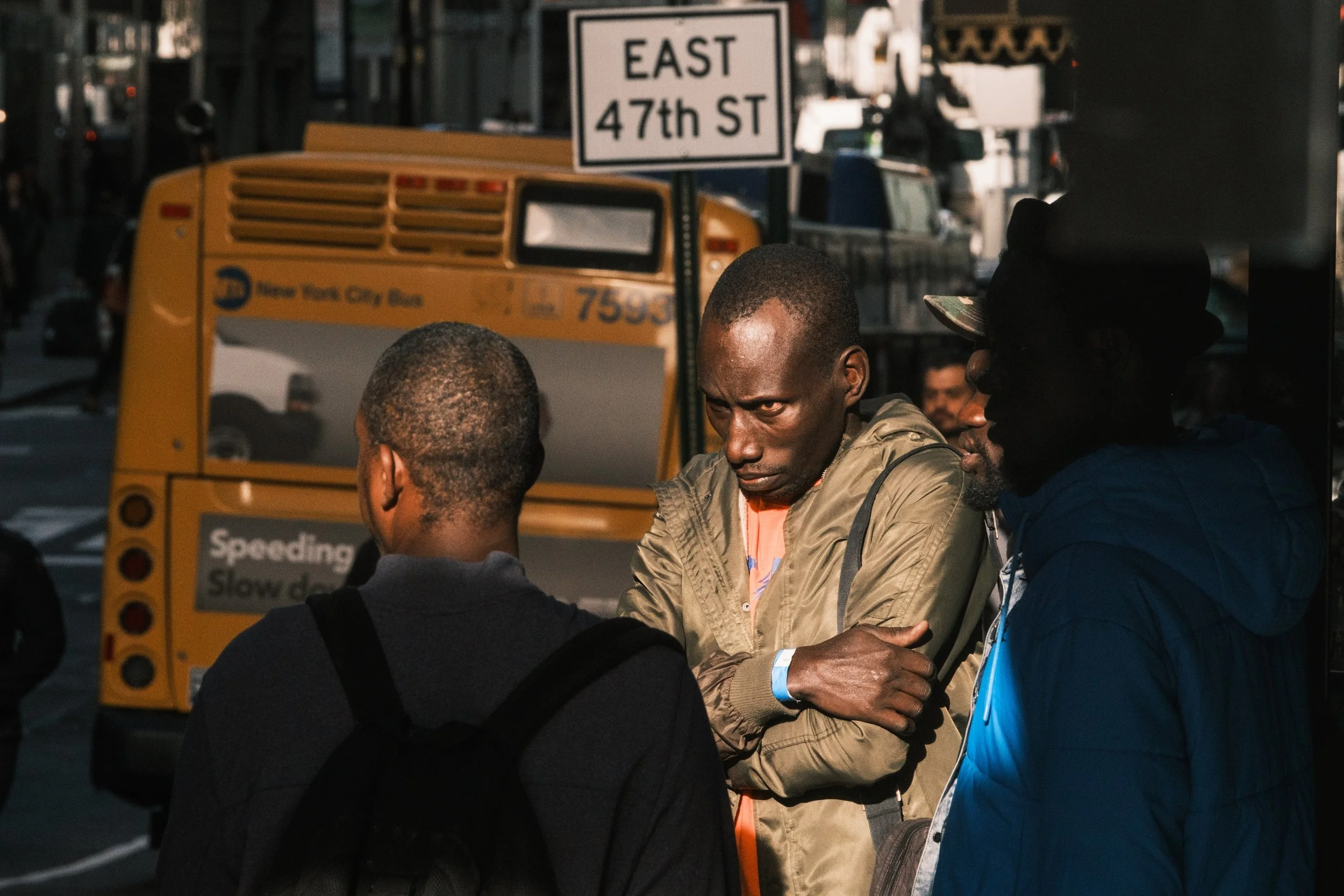 October 10, 2023 - New York, NY: Migrants seeking asylum in the United States gather outside of the Roosevelt Hotel in midtown Manhattan, the main processing center for arrivals and a residence for families traveling together.