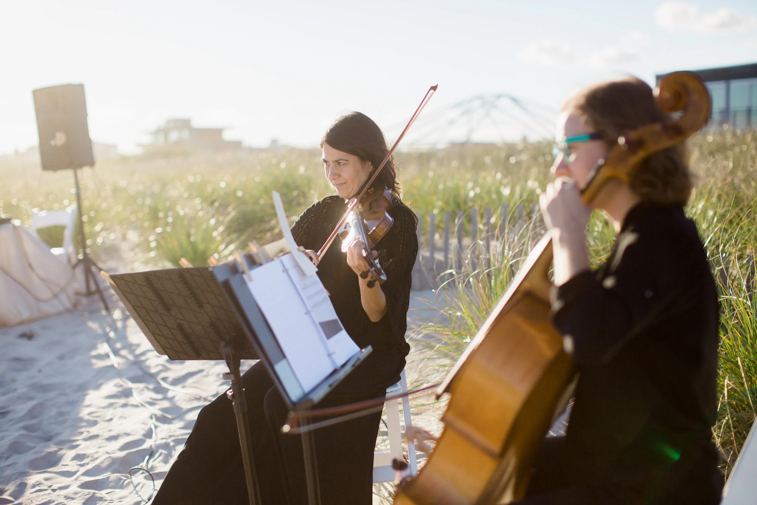 Photo of Luminous Sounds playing for a beachfront ceremony by Katie Kett Photography