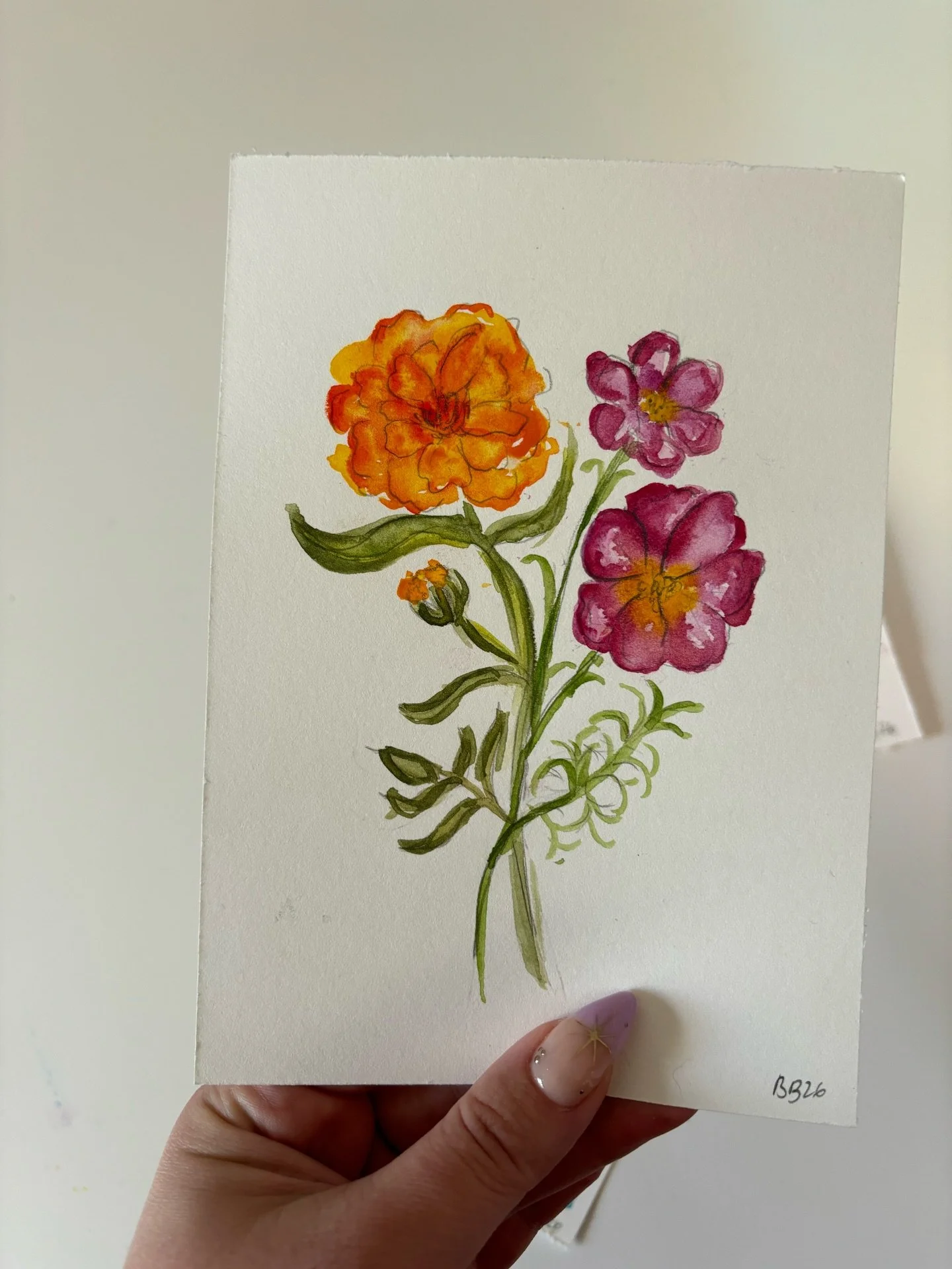 The work (cute little marigold and cosmo painting) ➡️ the progress (color palette for the painting and my scrap paper)