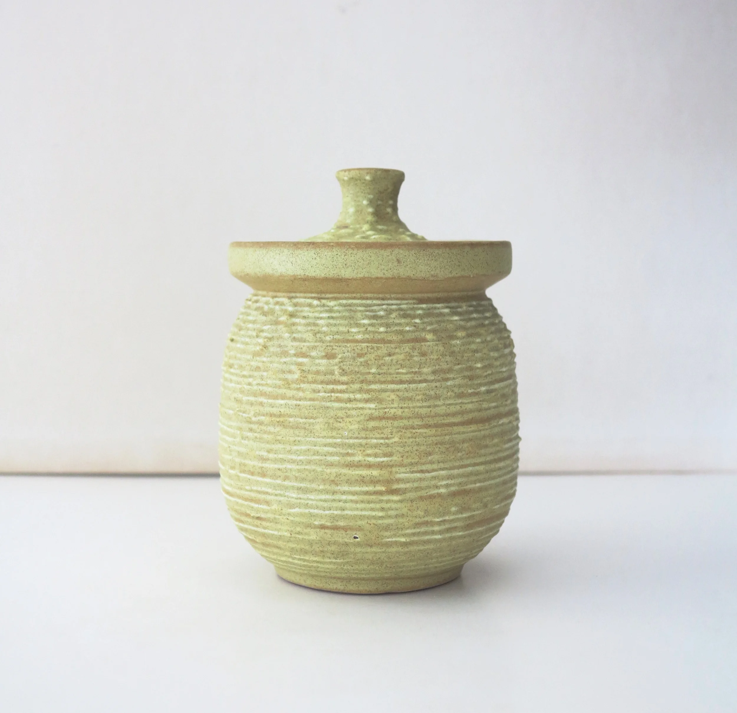 A c1950 Lee Rosen for Design-Technics Lidded Pottery Jar (Technic: TT). 5.37" h.