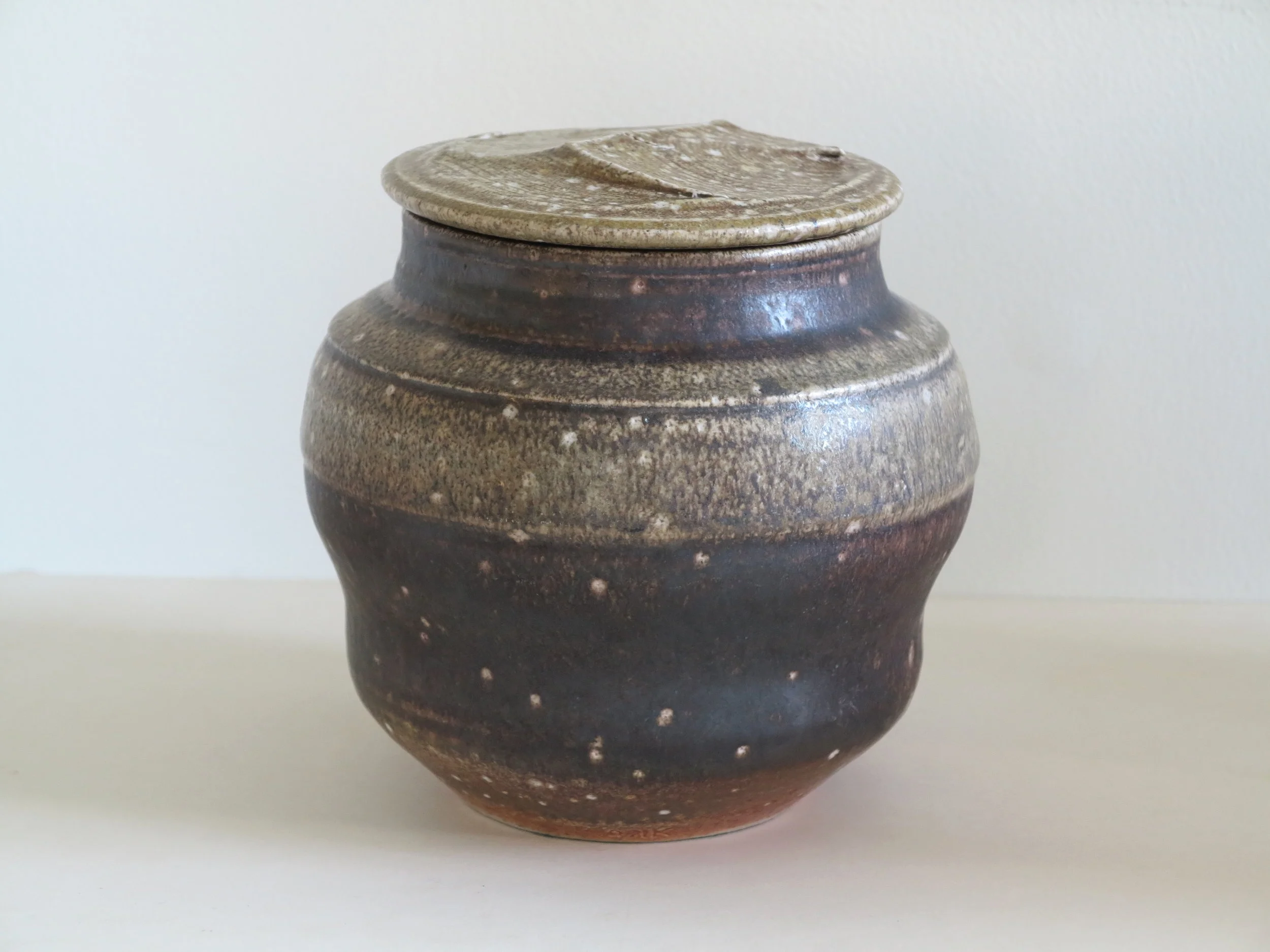 A late 1960s stoneware cut lid jar by Karen Karnes (1925-2016) 7.75" h. 7.5" dia.