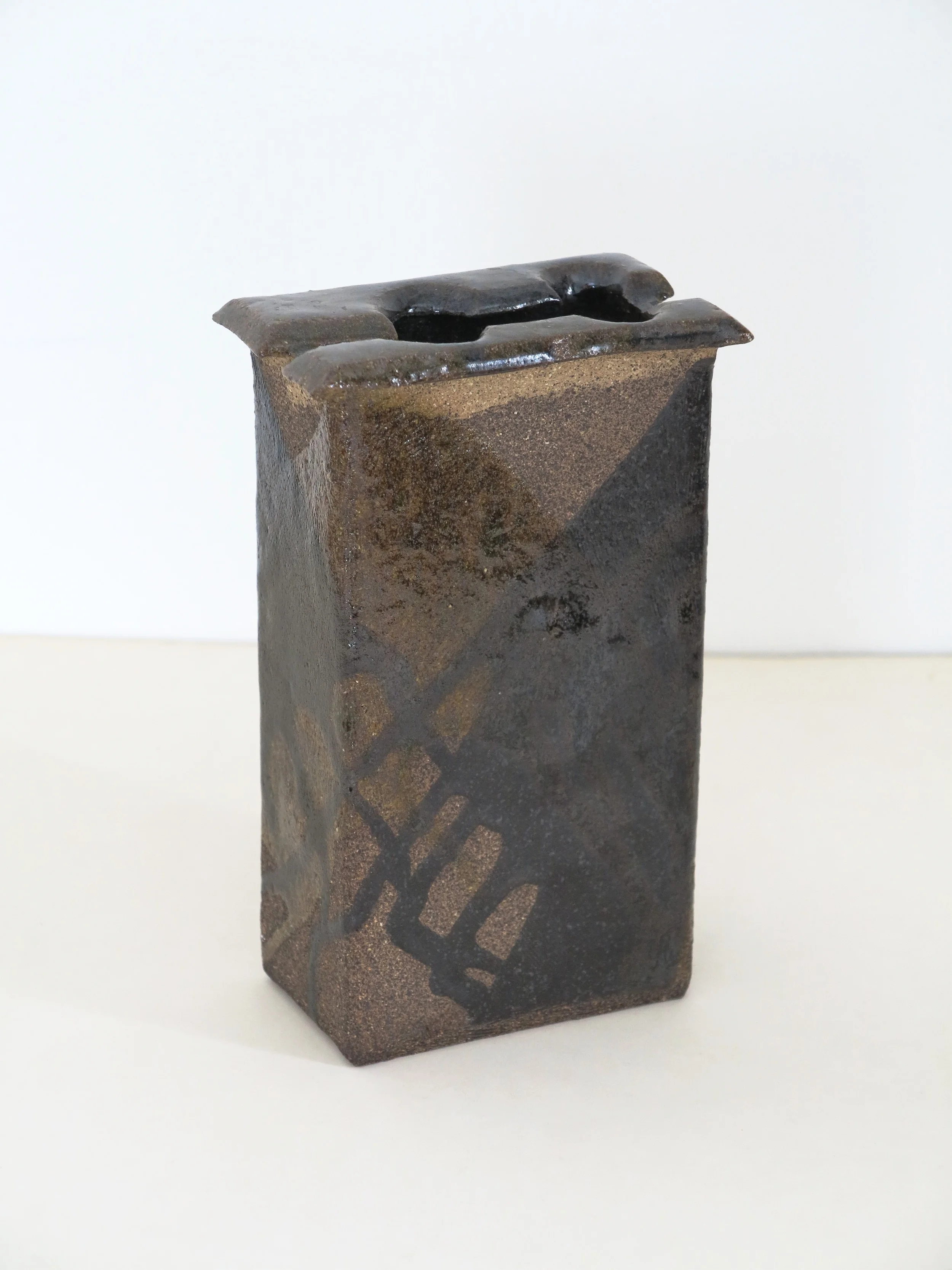 A c1970 slab built stoneware vase by Nancy Wickham (1923-1987). 7.75" h.