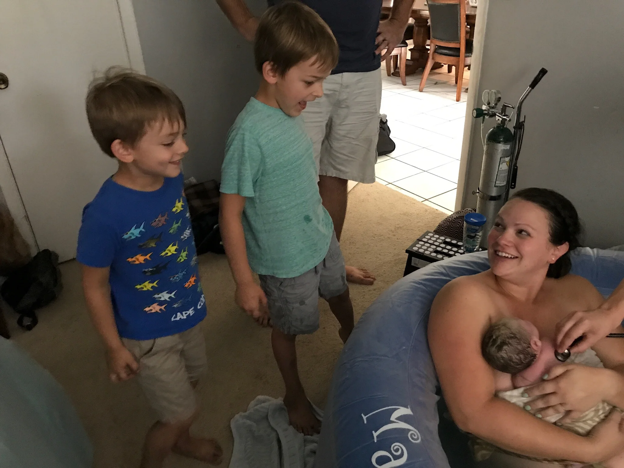 The boys meeting Evan just minutes after his birth.