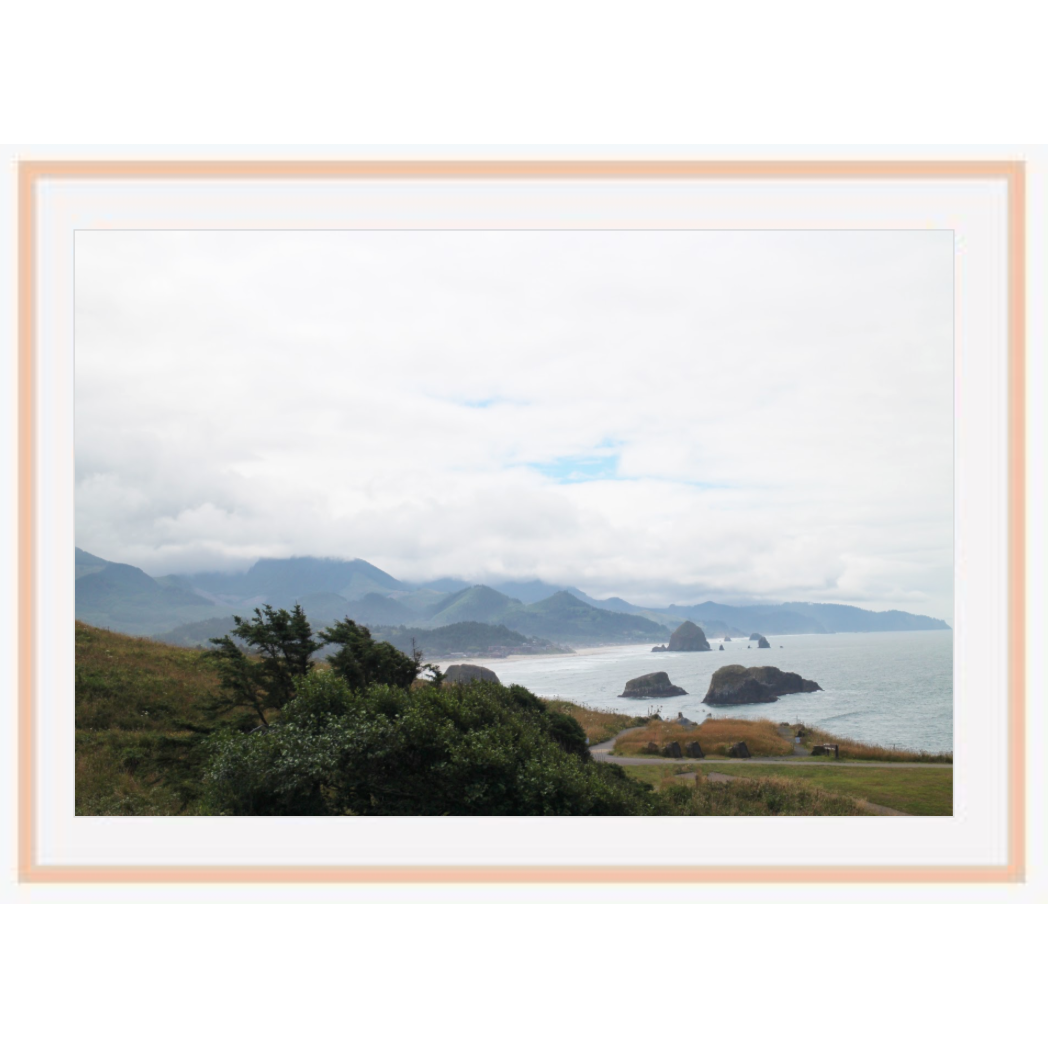 Copy of "Cannon Beach" photo with natural wood frame by Emily Roggenburk.