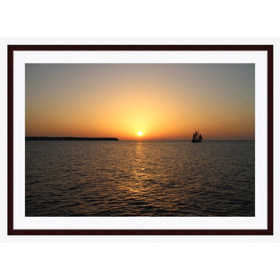 "Santorini Sunset" photo with dark brown wood frame by Emily Roggenburk.