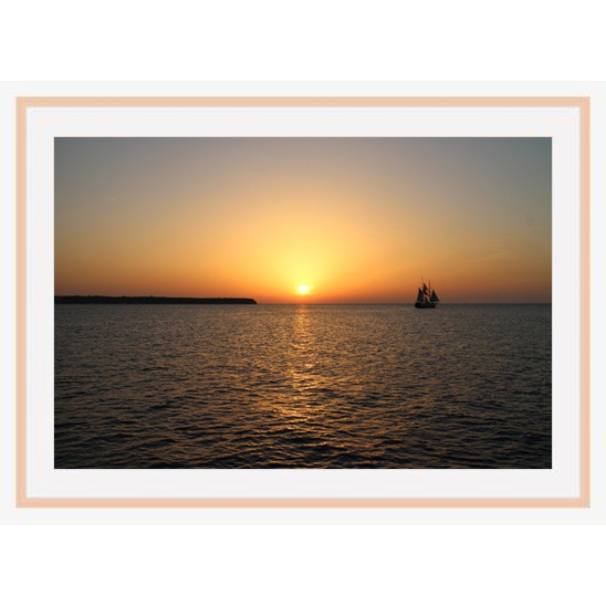 "Santorini Sunset" photo with natural wood frame by Emily Roggenburk.