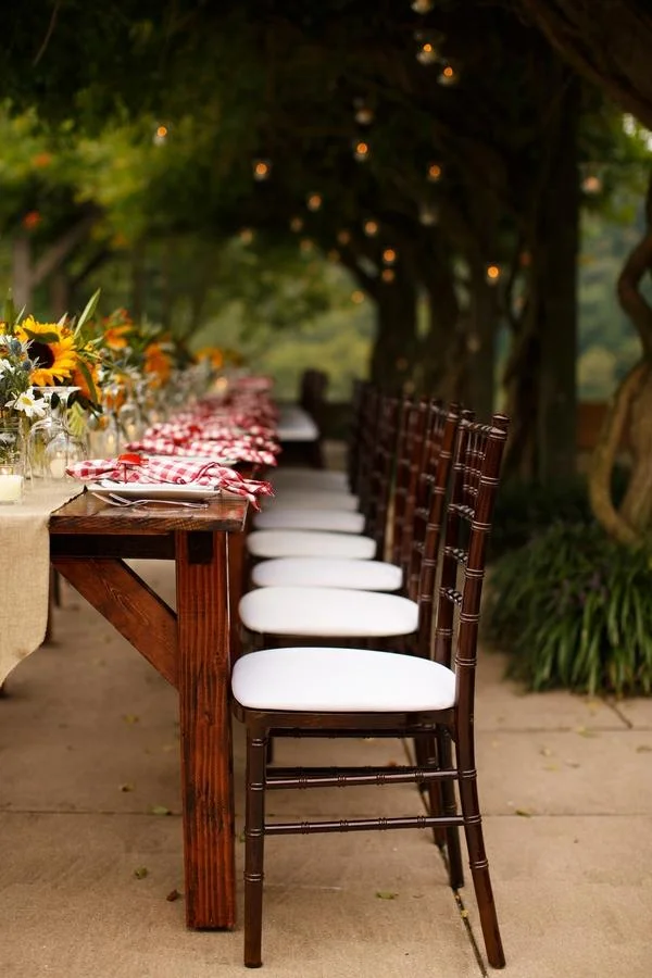 Rustic wedding tablescape with candles and floral details