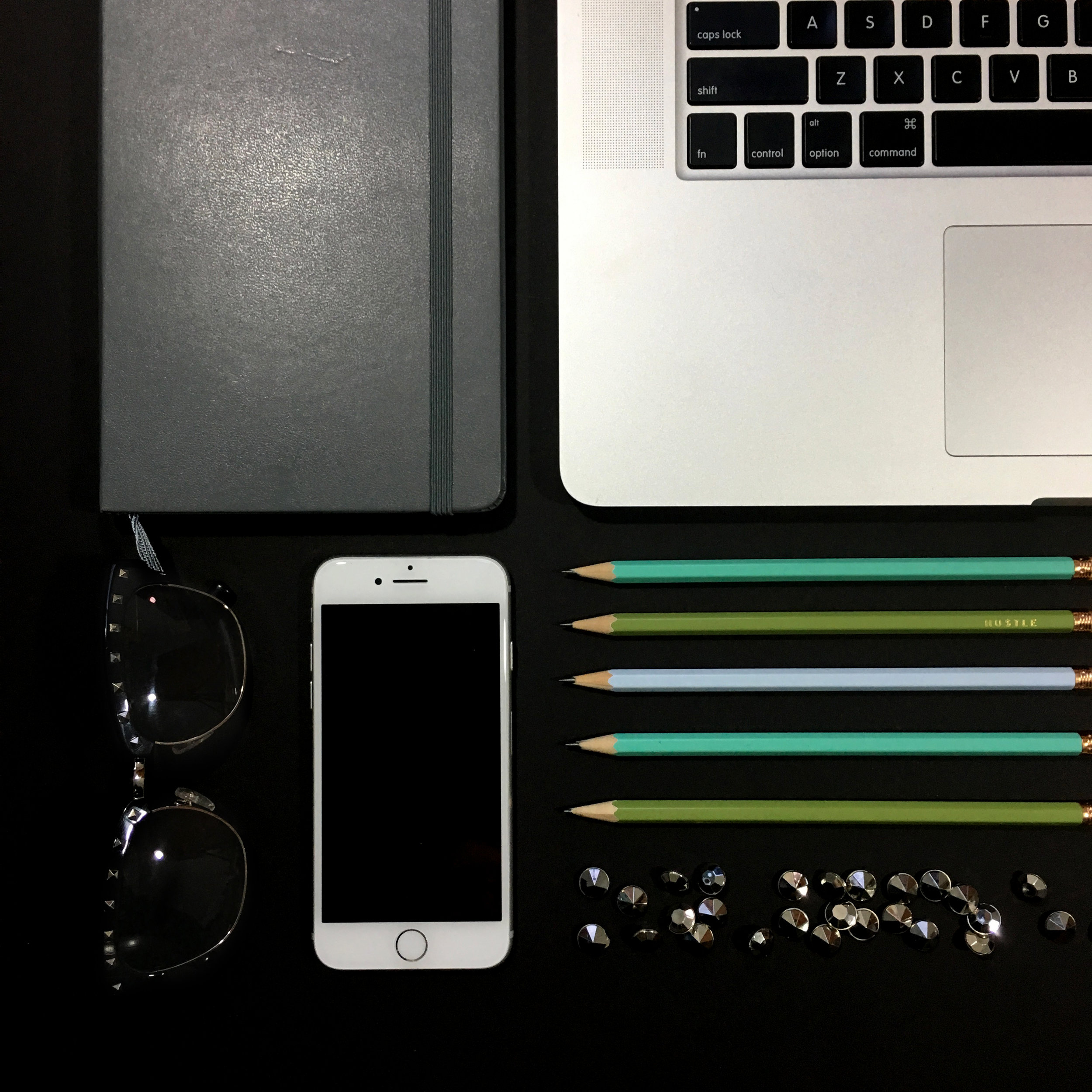WorkComputerPencilsPhoneNotebookGlassesGems.jpg