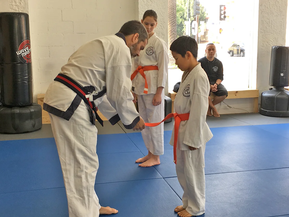 Two more 7th Gup recipients - orange belt with a stripe