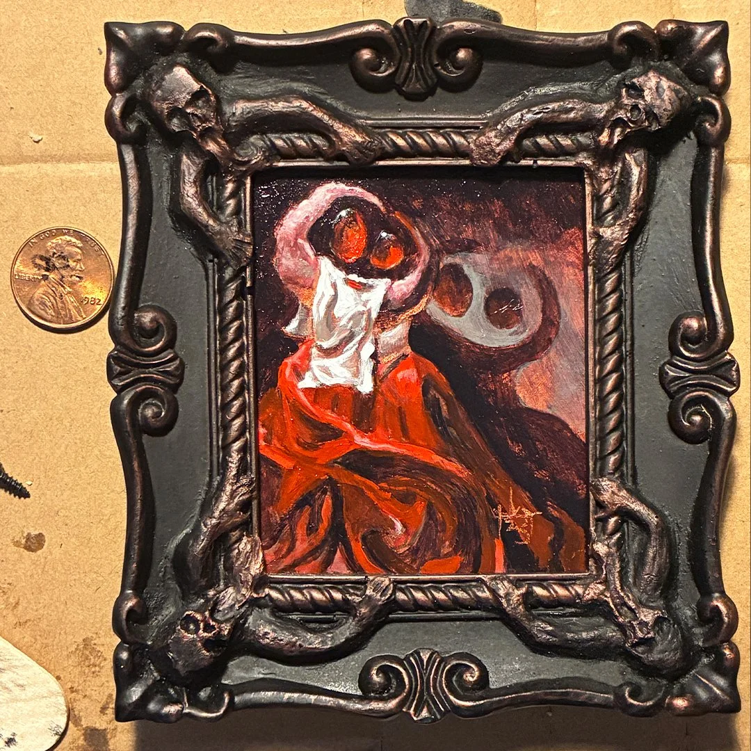 The Cardinal Mini painting in custom resin frame with iridescent bronze