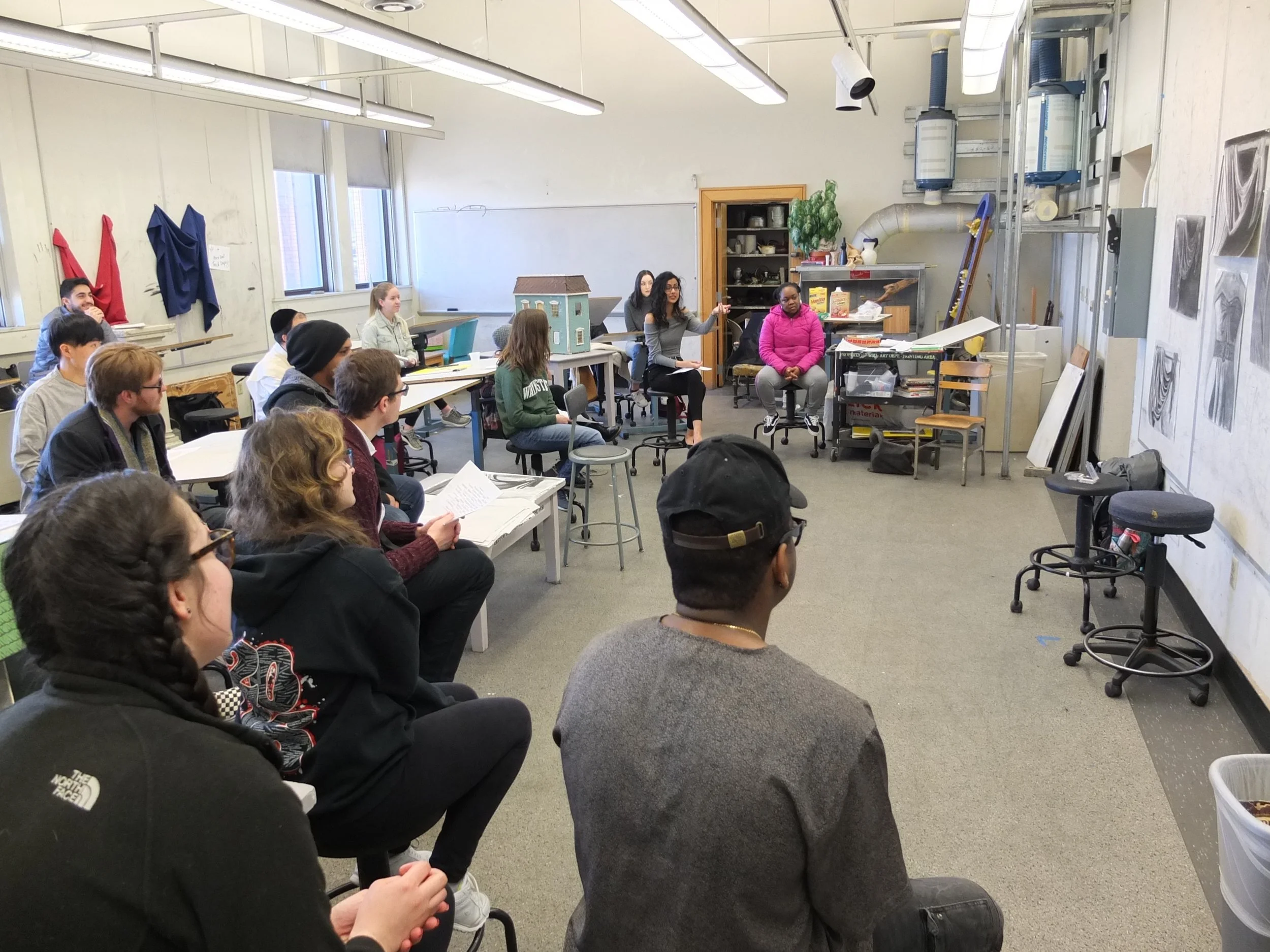 Students participating in a critique.